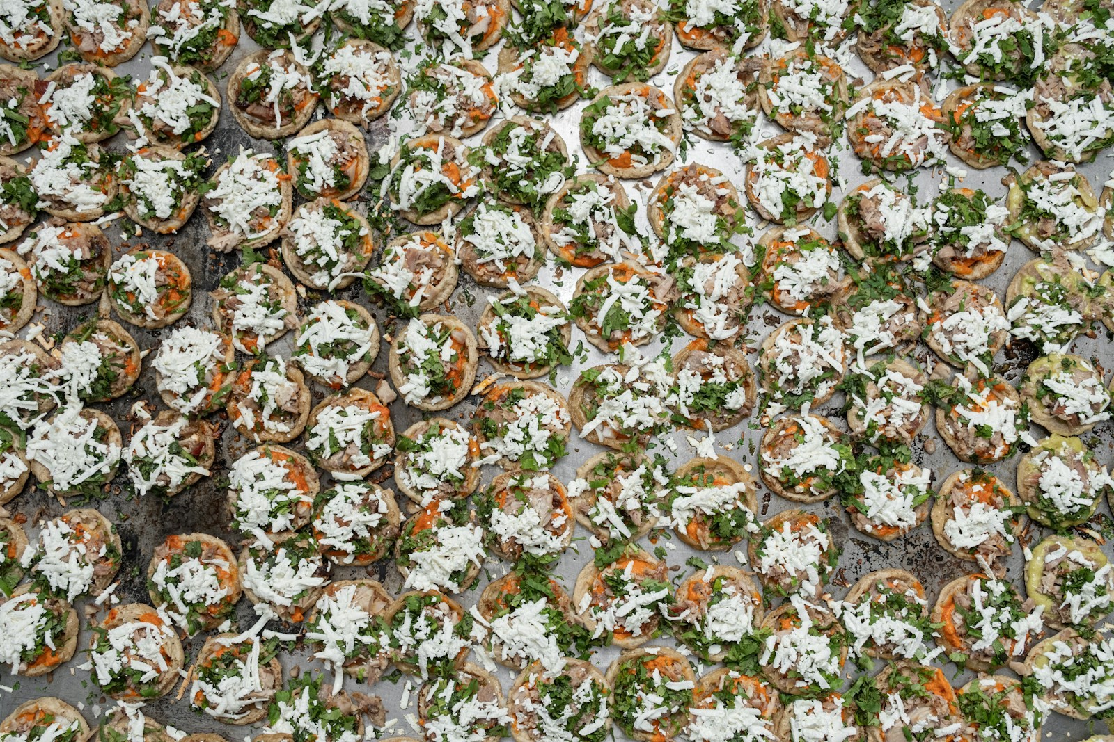 Tray of filled caps prepped ahead before baking