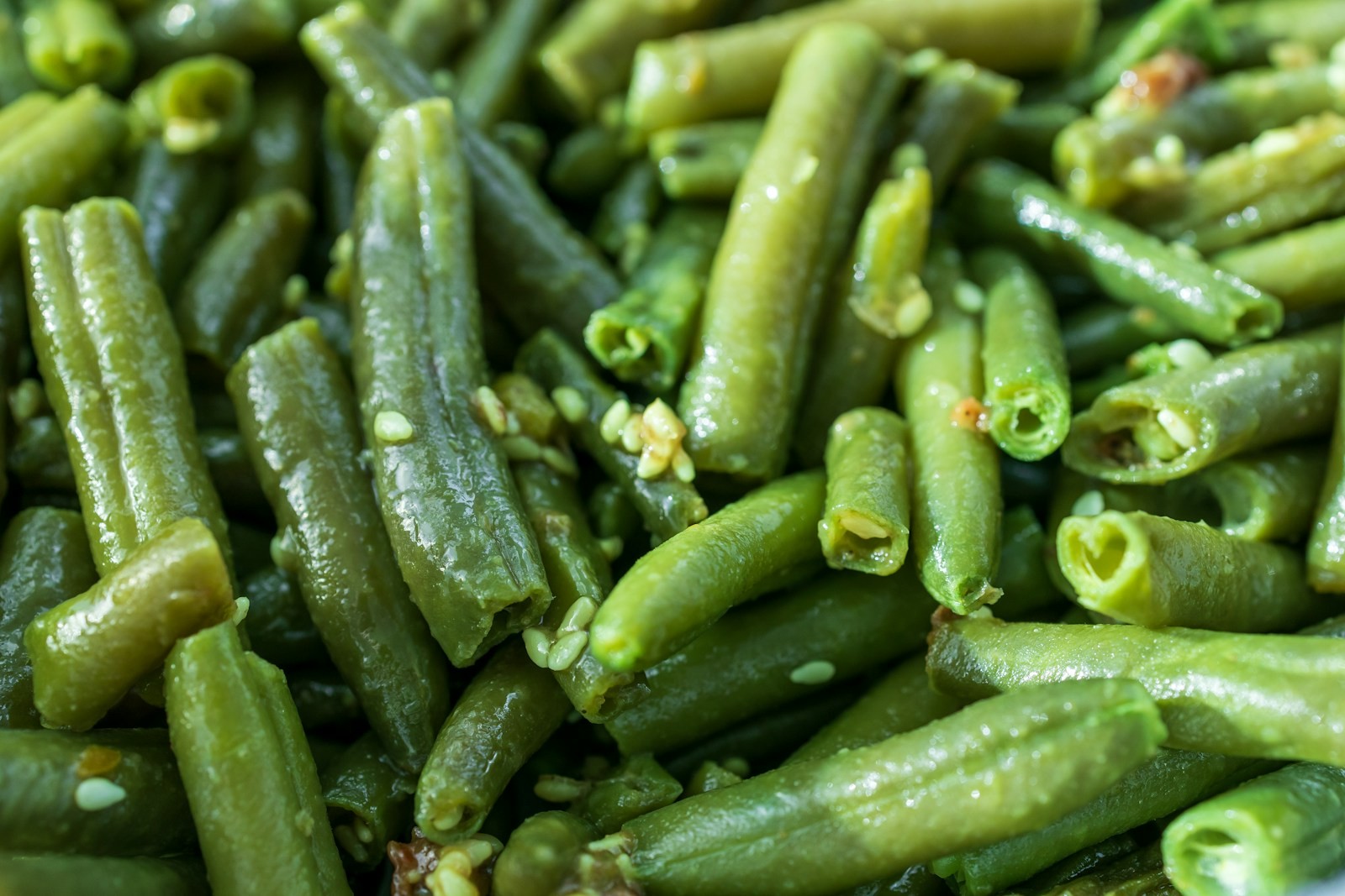 Glossy sauteed green beans in a pan