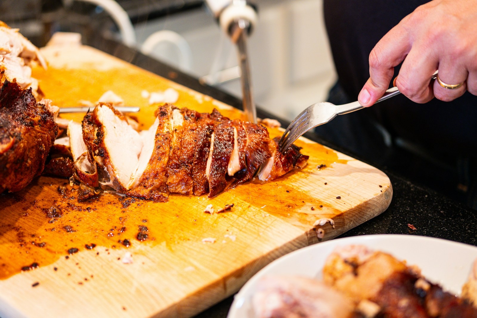 Carving board with sliced roast turkey and a knife