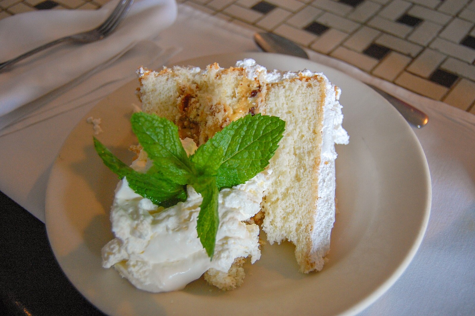 Slice of Southern lane cake with whipped cream
