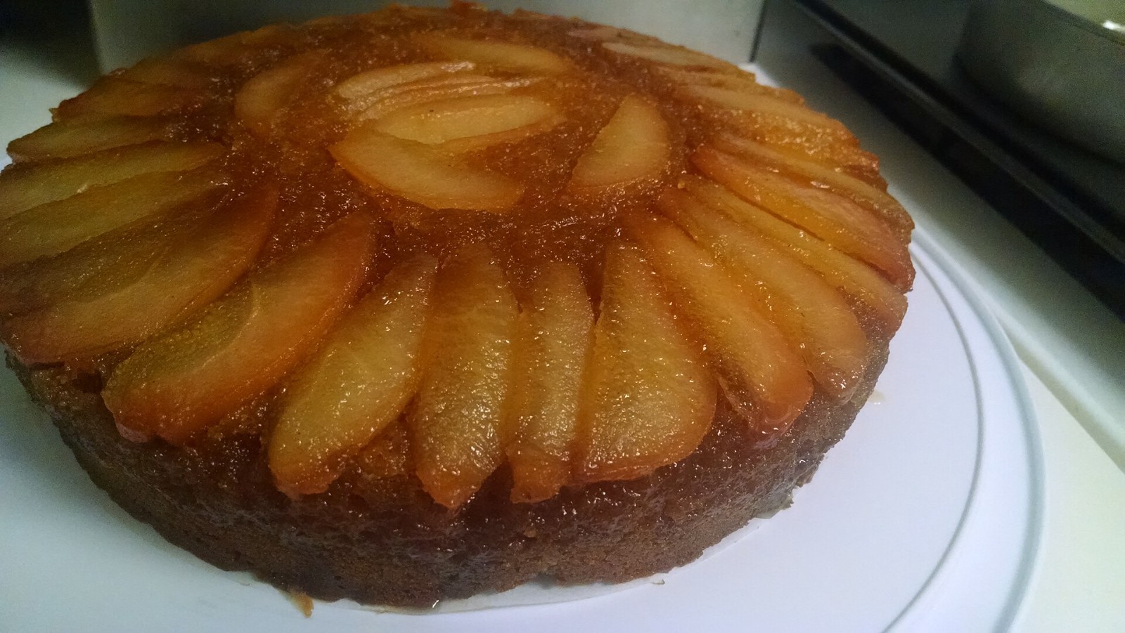 Caramelized pear upside-down cake on a plate