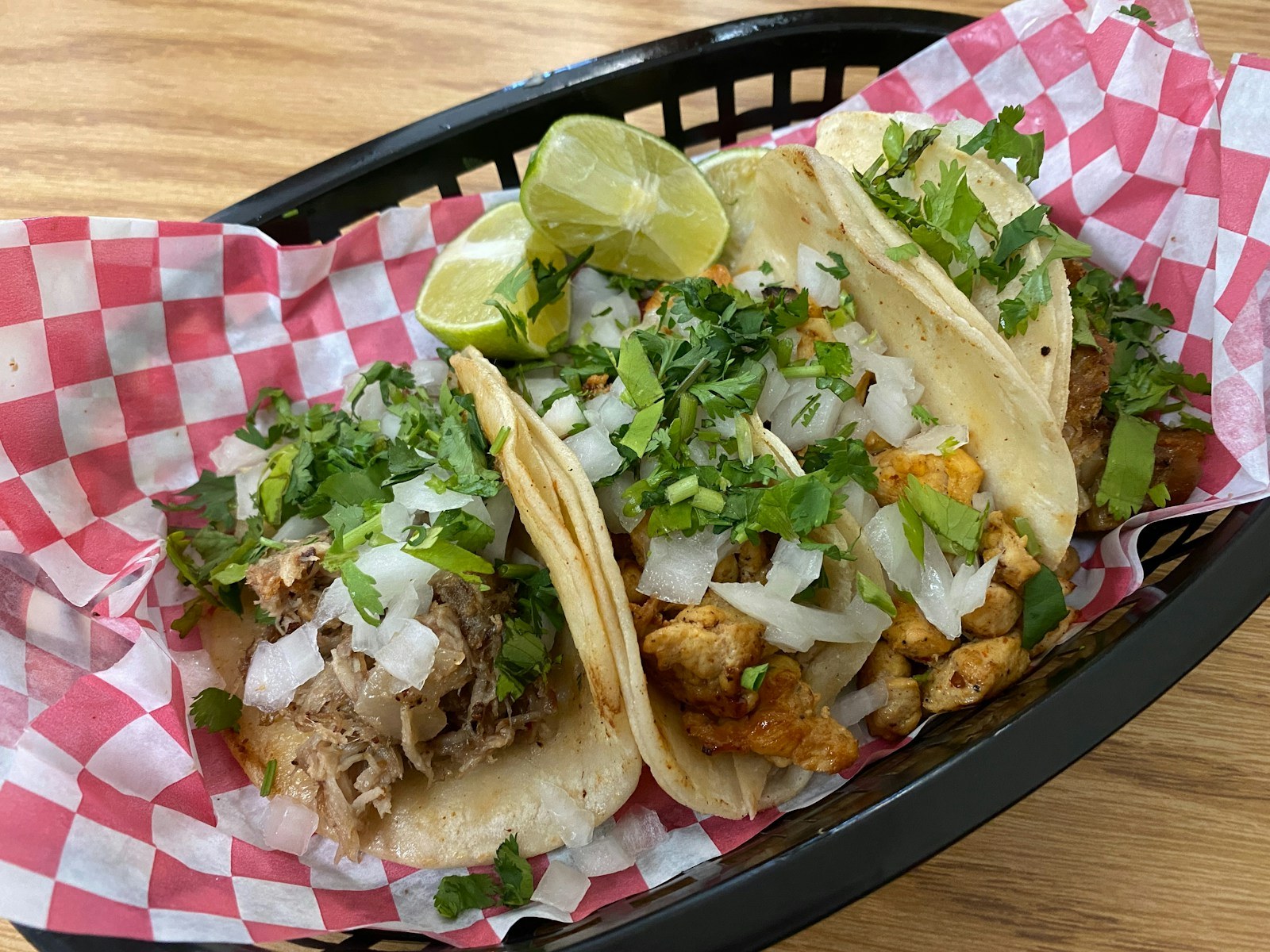 Pork carnitas tacos with onion, cilantro and lime