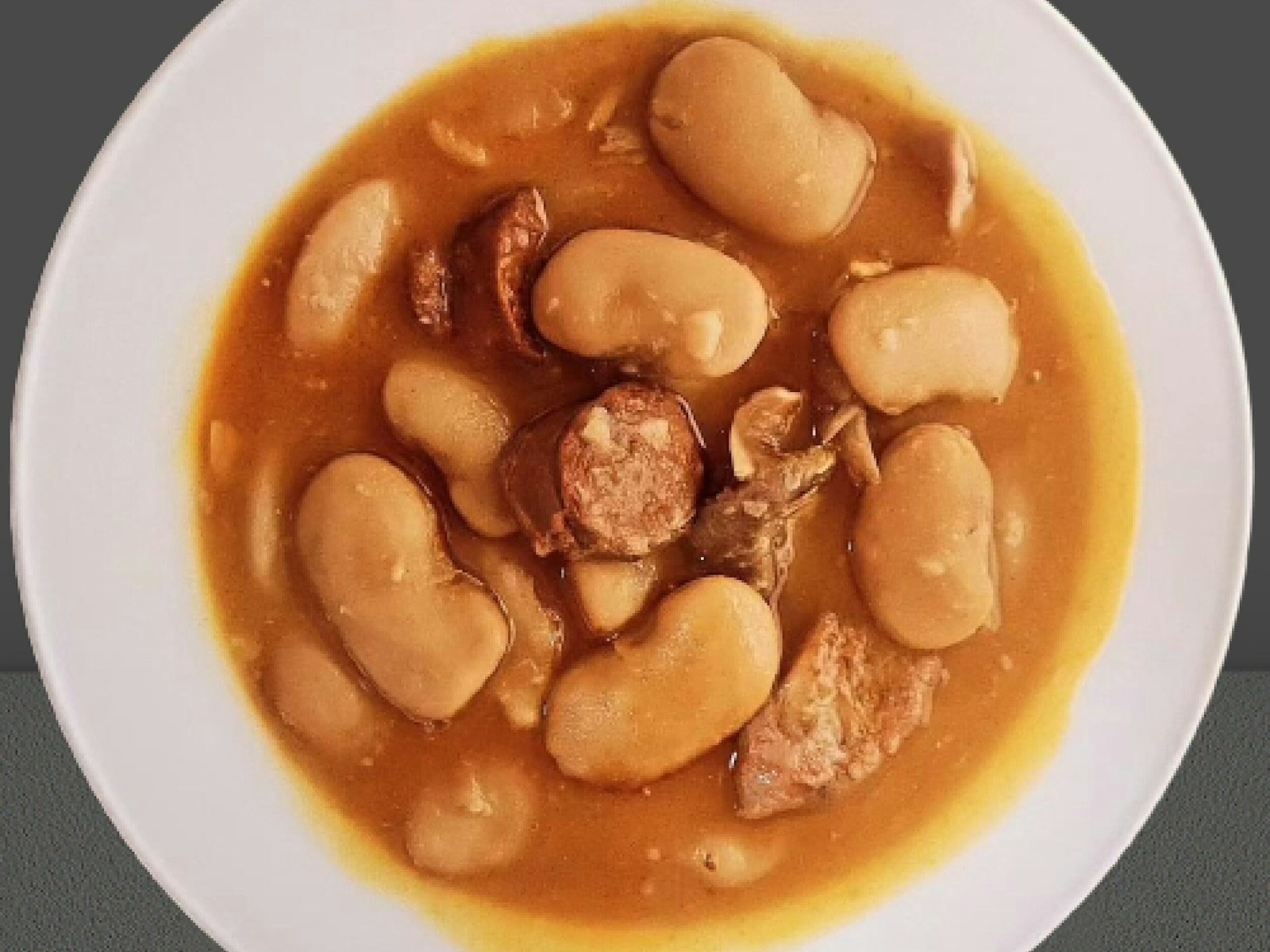 Bowl of white bean soup that freezes well for winter meals
