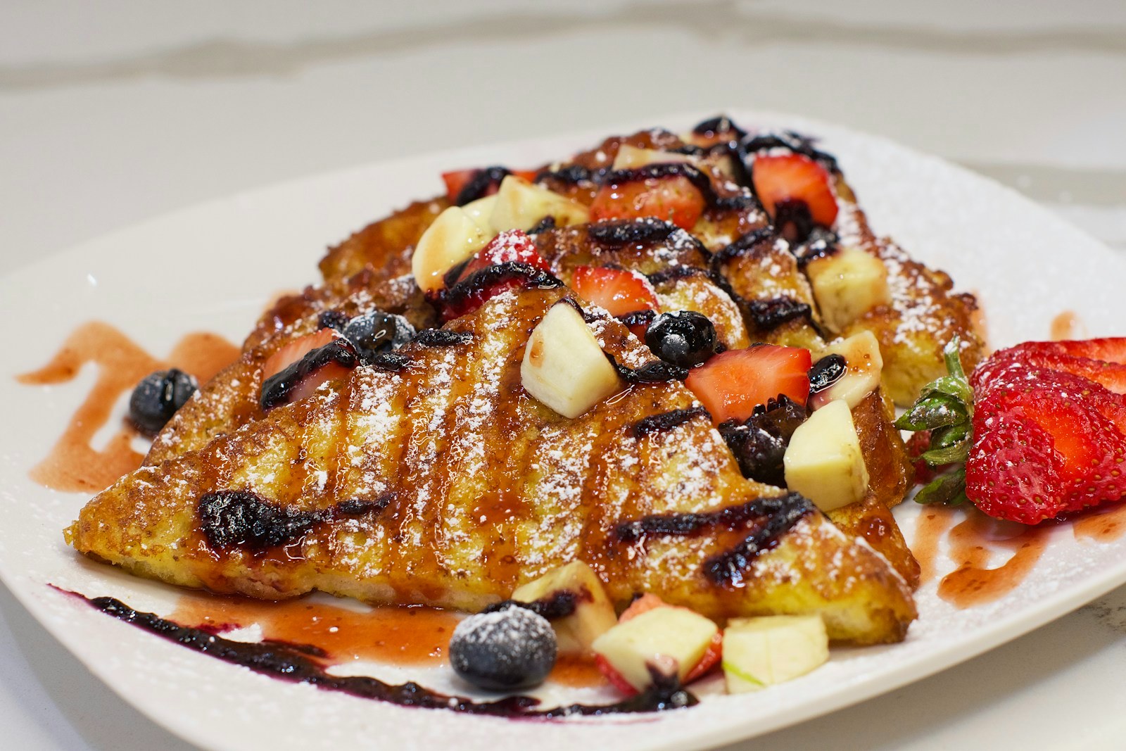 French toast bake topped with berries for a holiday breakfast