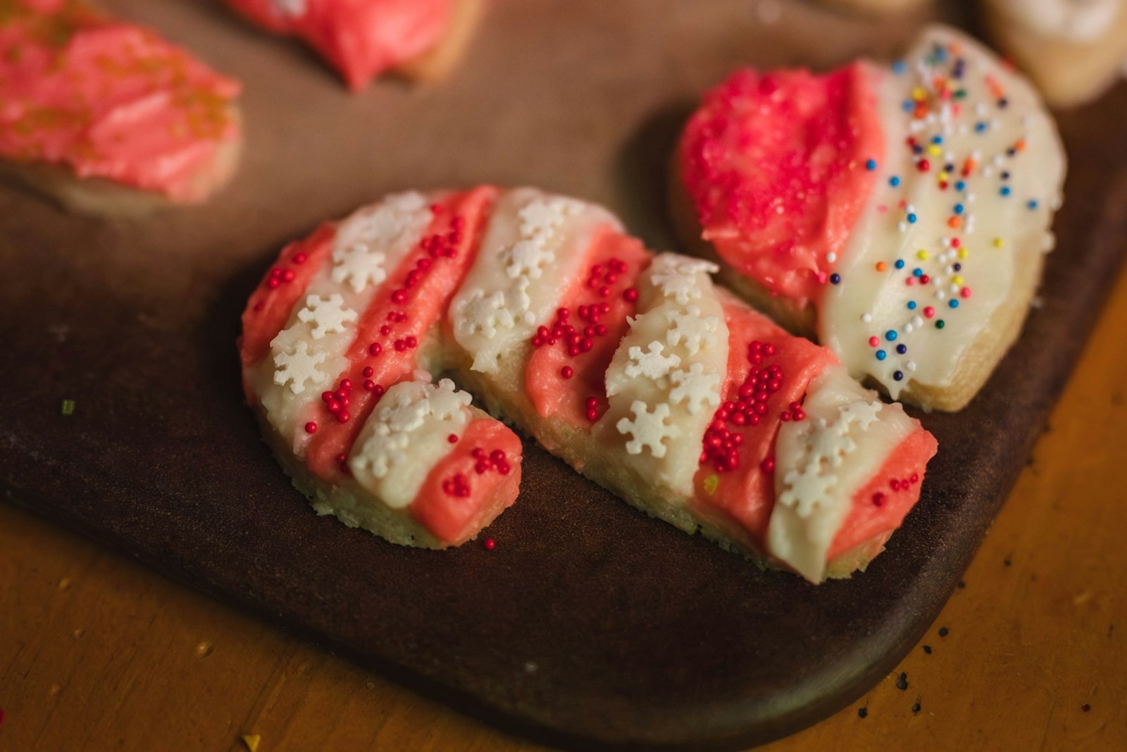 Red and white candy cane twists on a wooden board