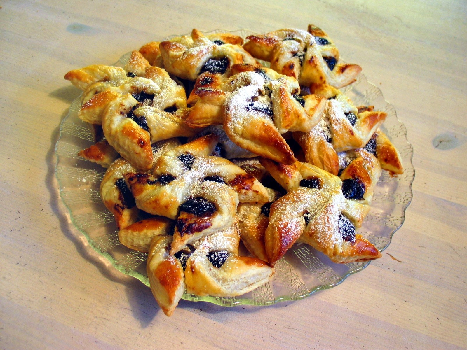 Finnish star pastries with plum jam dusted with powdered sugar