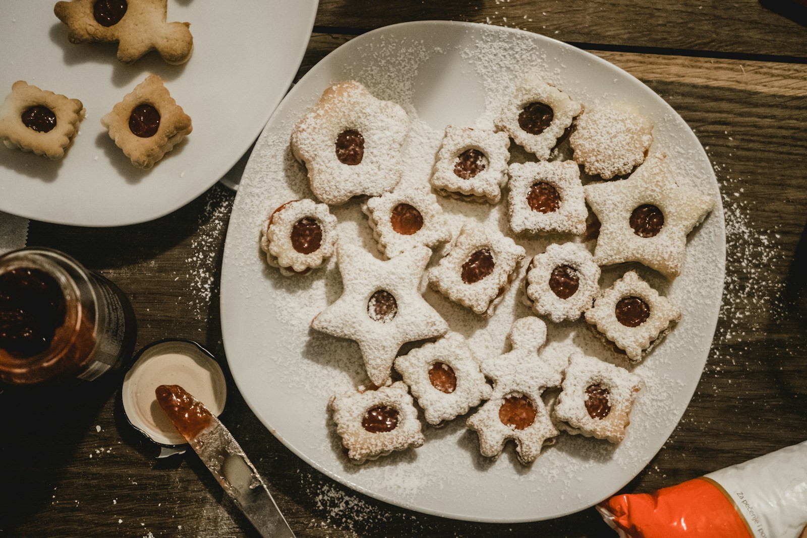 Linzer star showstopper Christmas cookies filled with jam and dusted with powdered sugar