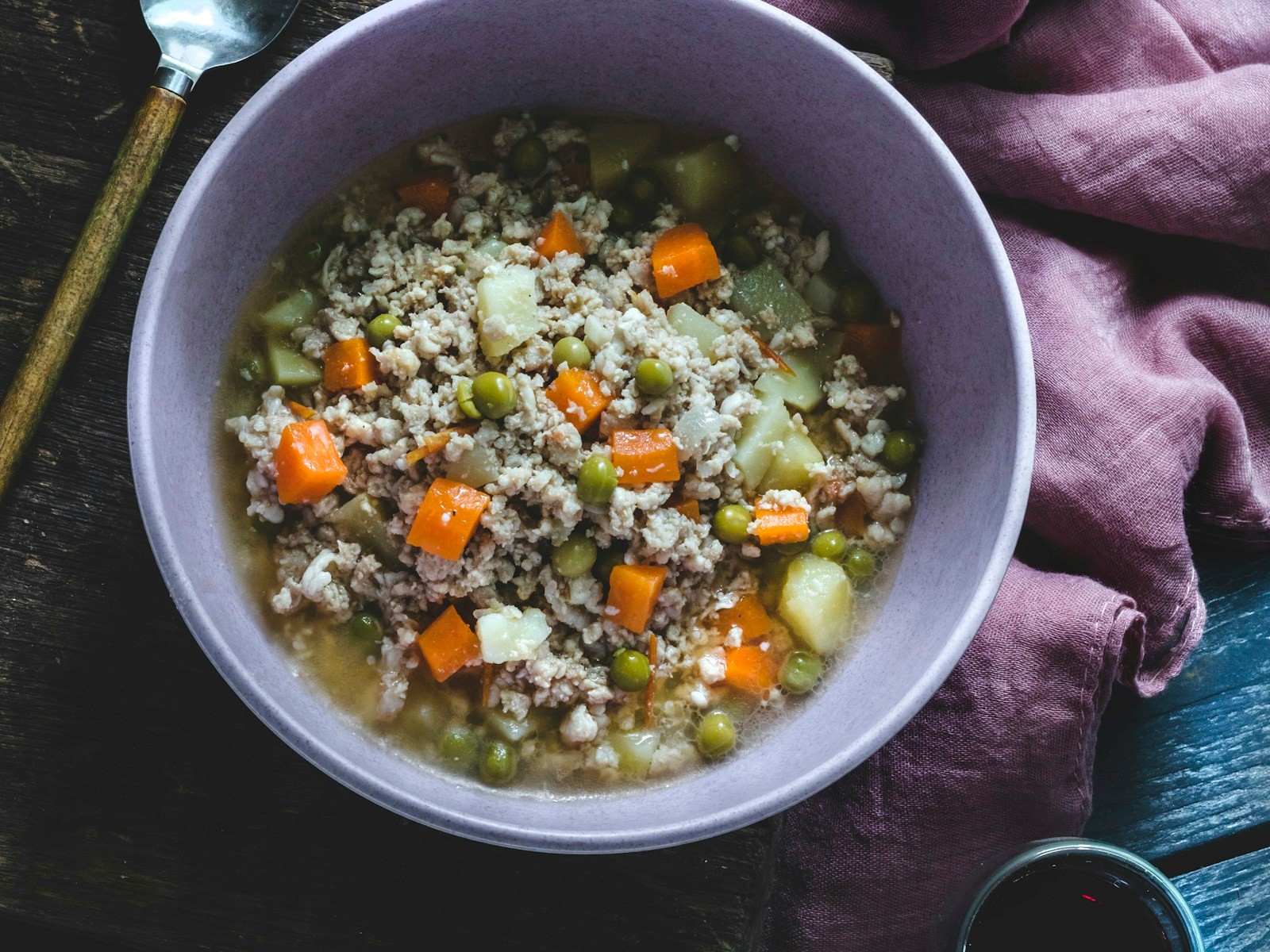 Bowl of beef and barley soup with vegetables