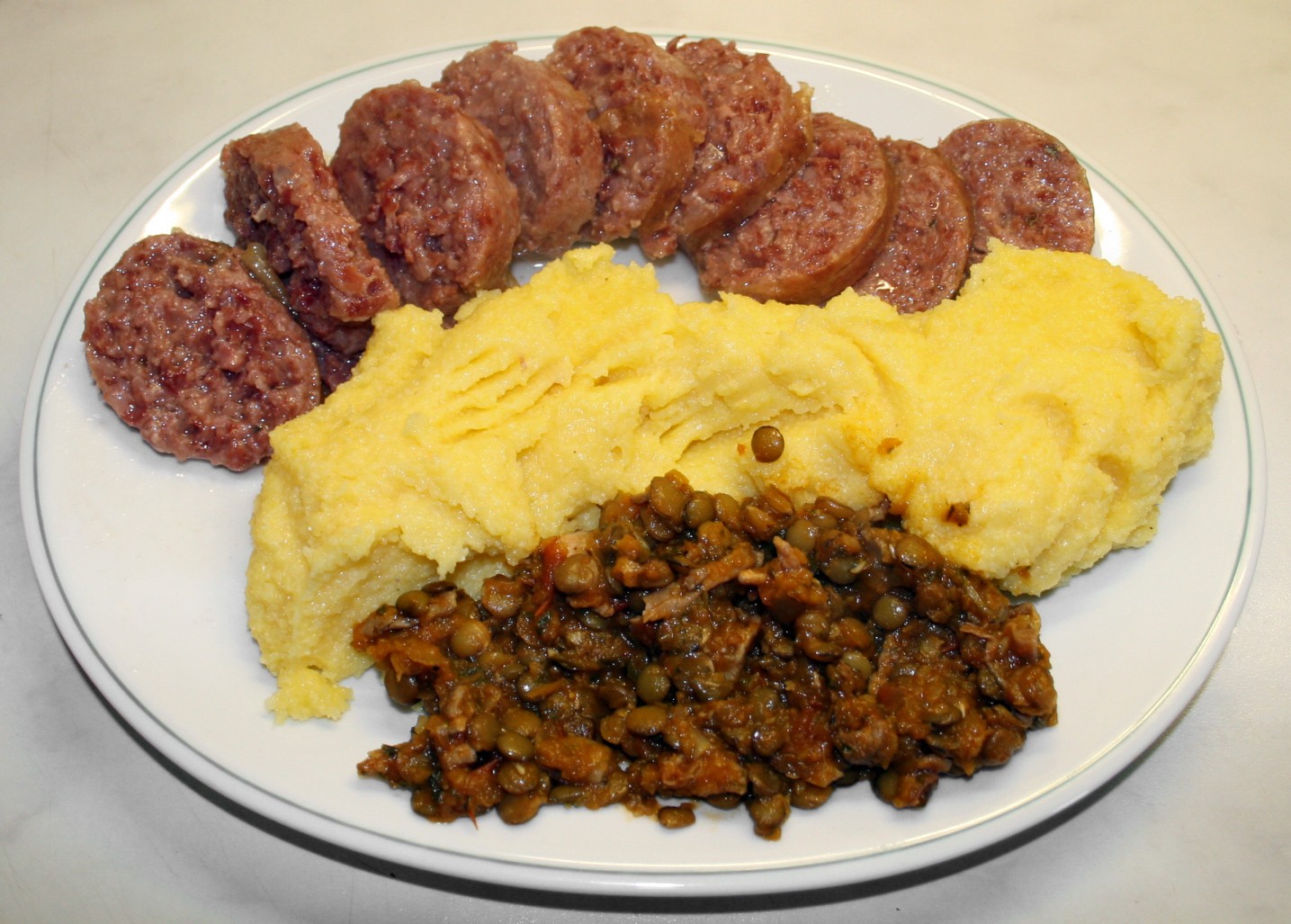 Creamy polenta served with Italian sausage