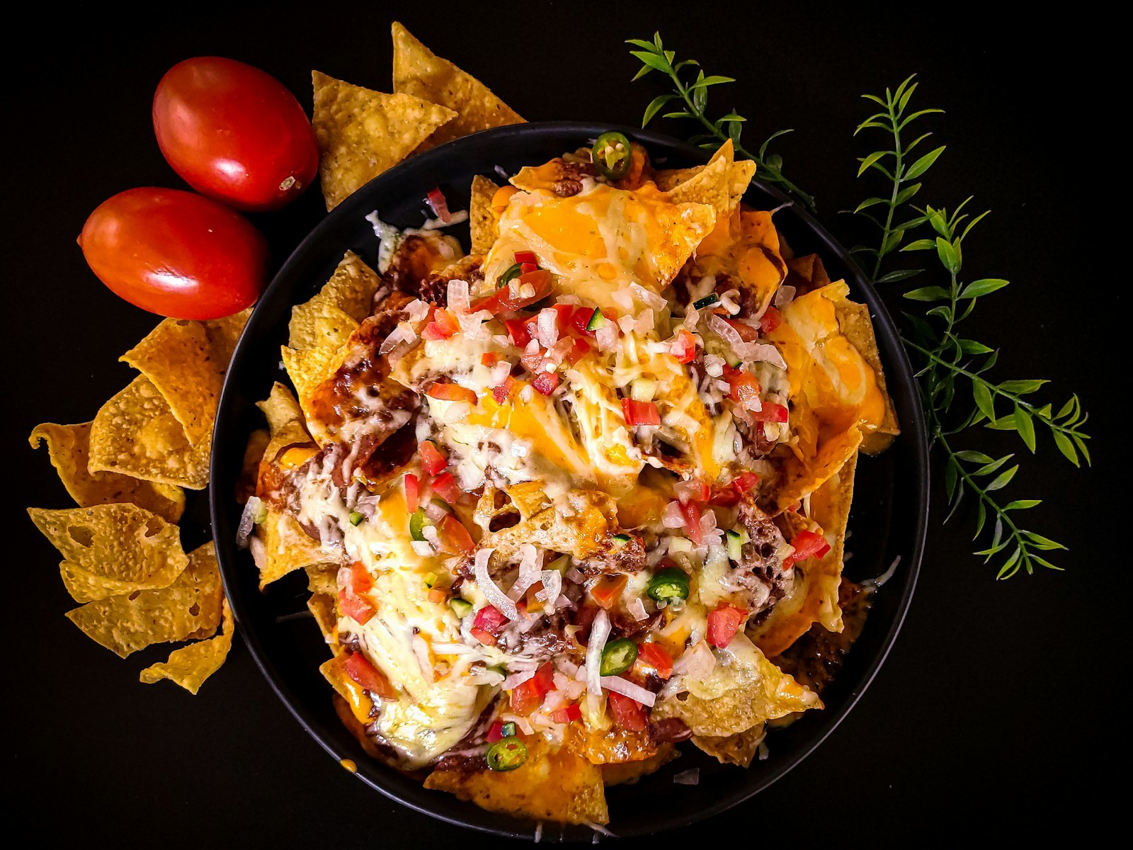 Chili cheese nacho casserole with beef, salsa and melted cheese