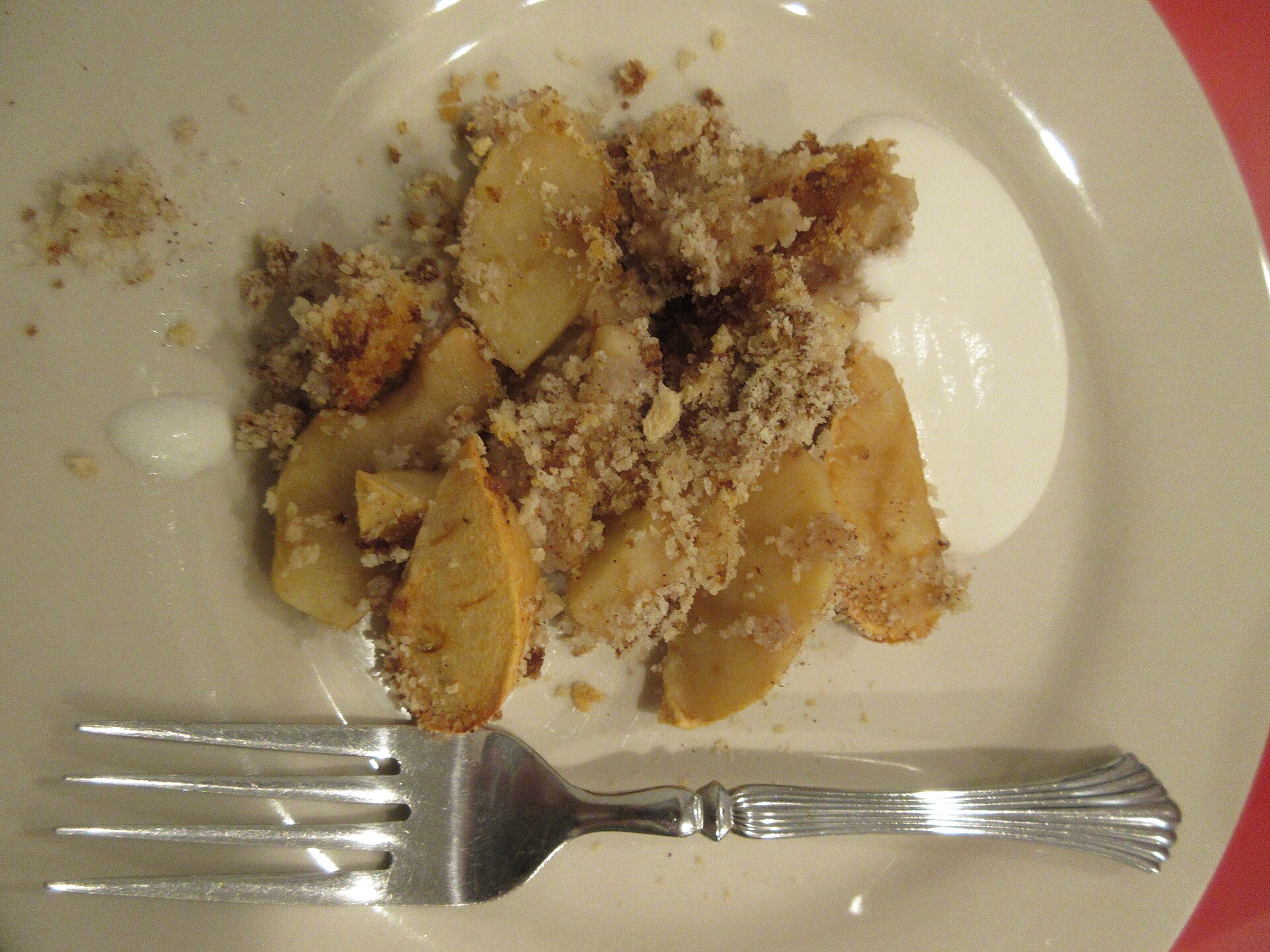 A serving of apple brown betty with buttery crumbs