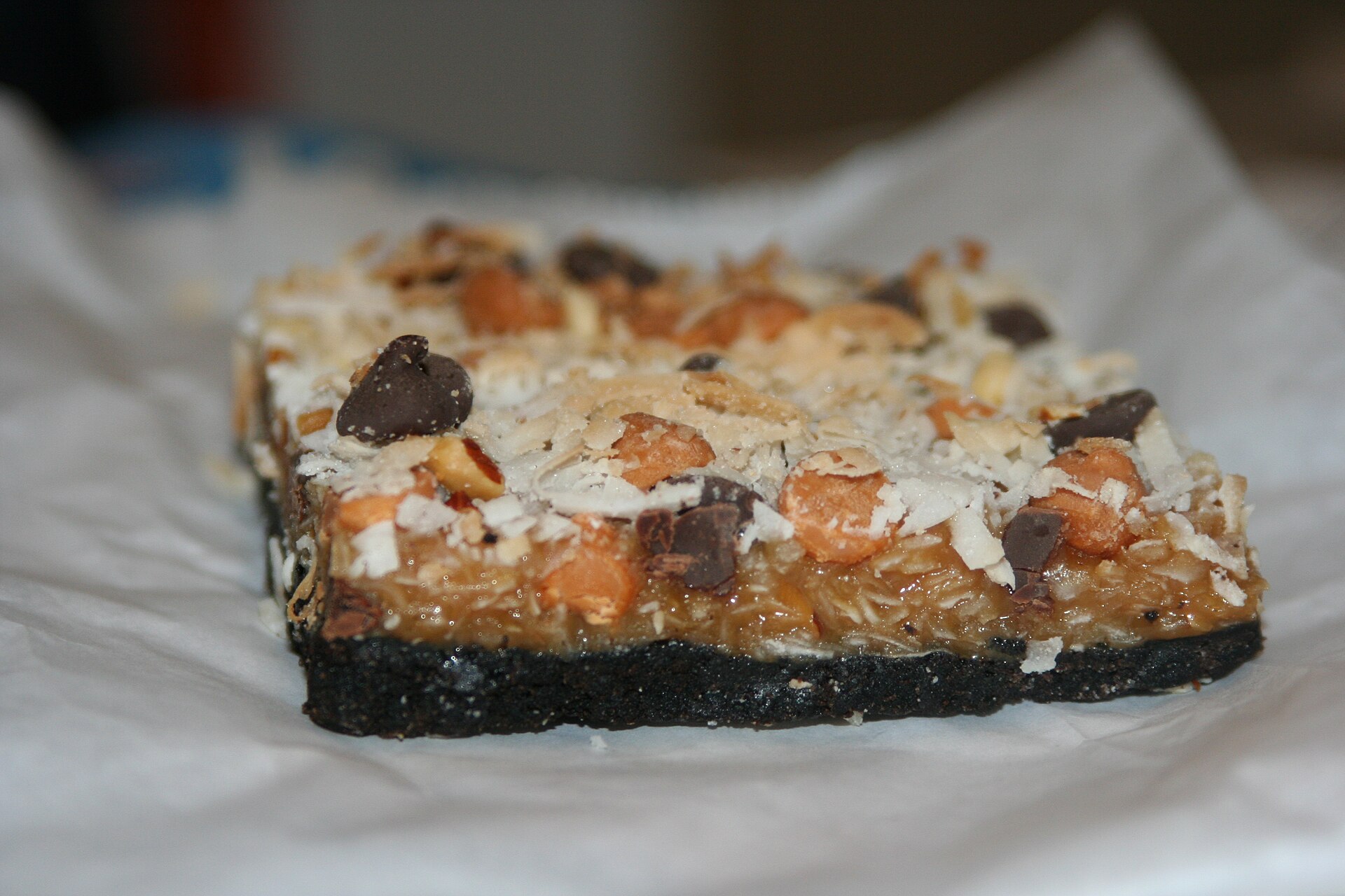 A magic bar, one of the funny named desserts, with coconut, chocolate chips and pecans