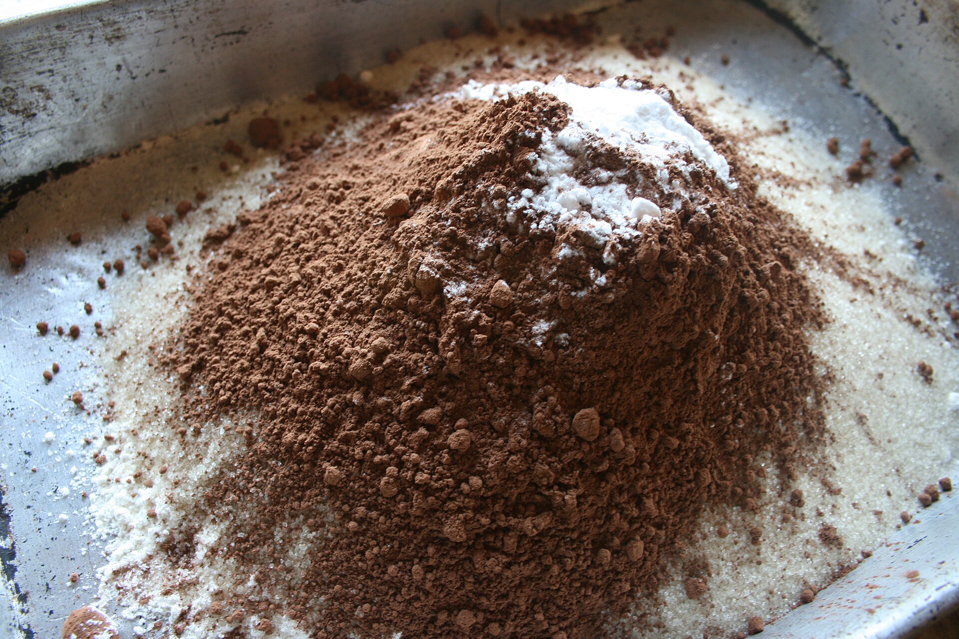 Dry ingredients for wacky cake mixed right in the baking pan