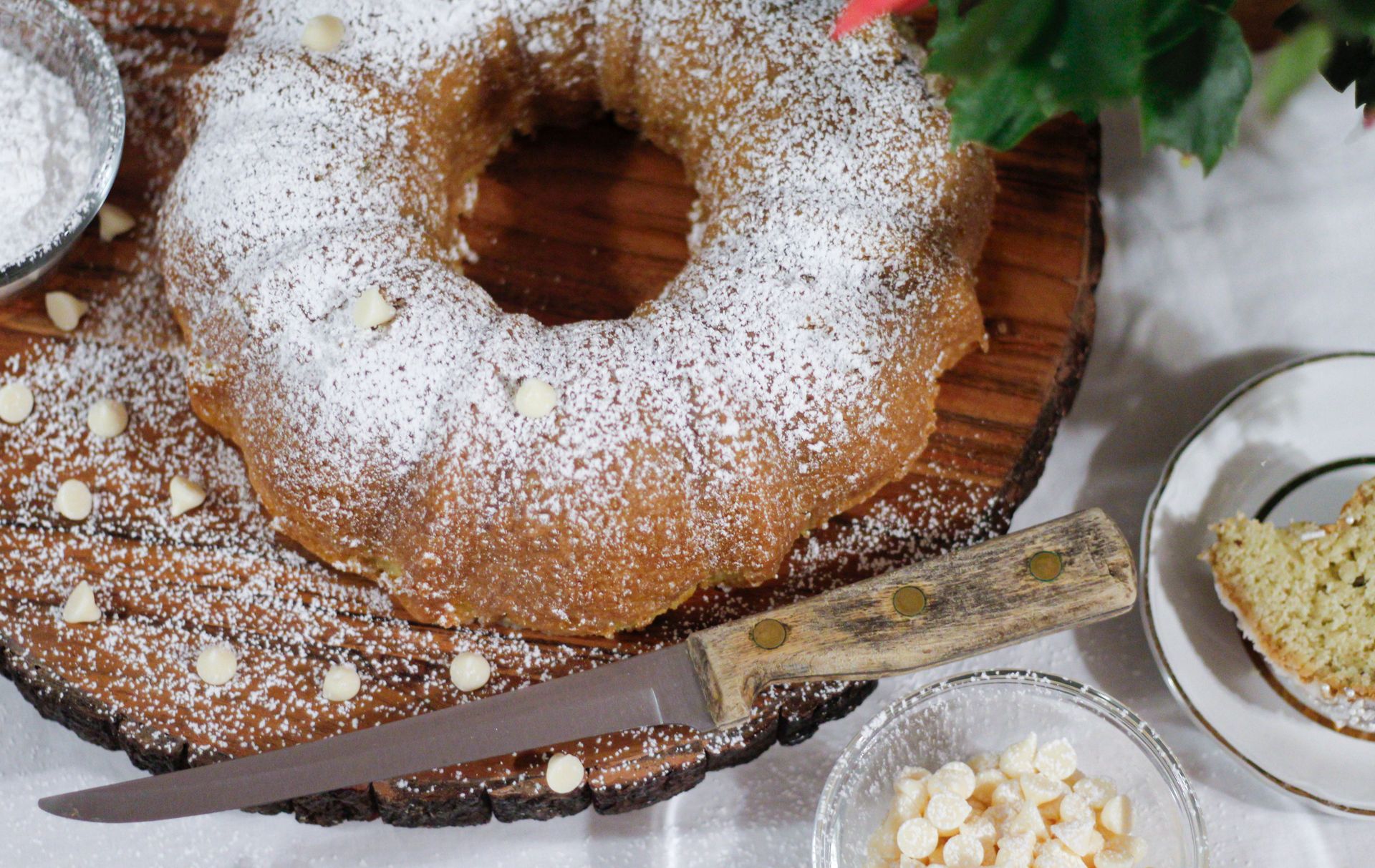Ring cake dusted with powdered sugar with chocolate pieces
