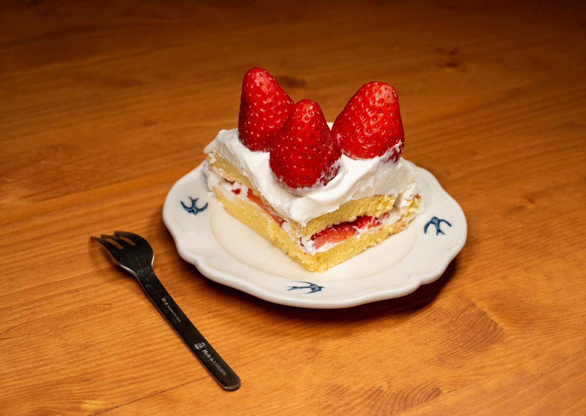 Strawberry shortcake slice with cream and fresh strawberries