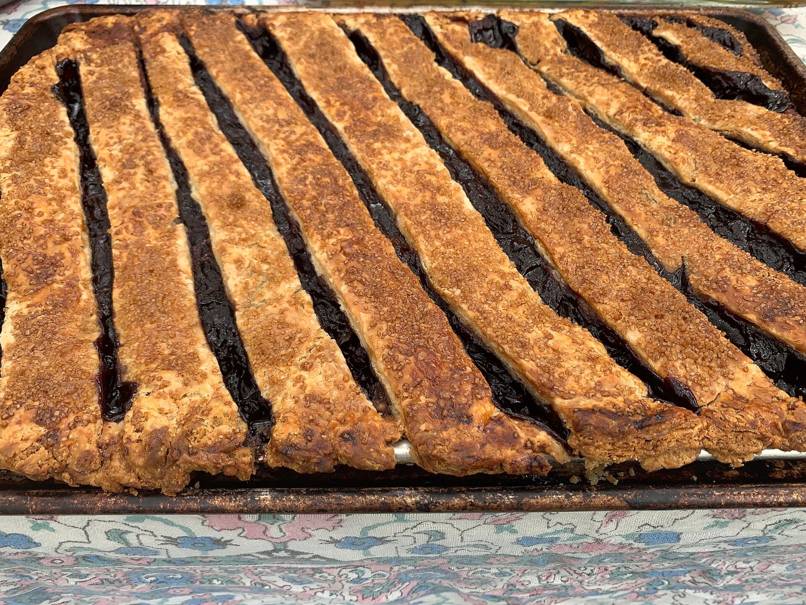 Slab pies with wide lattice strips in a rimmed sheet pan