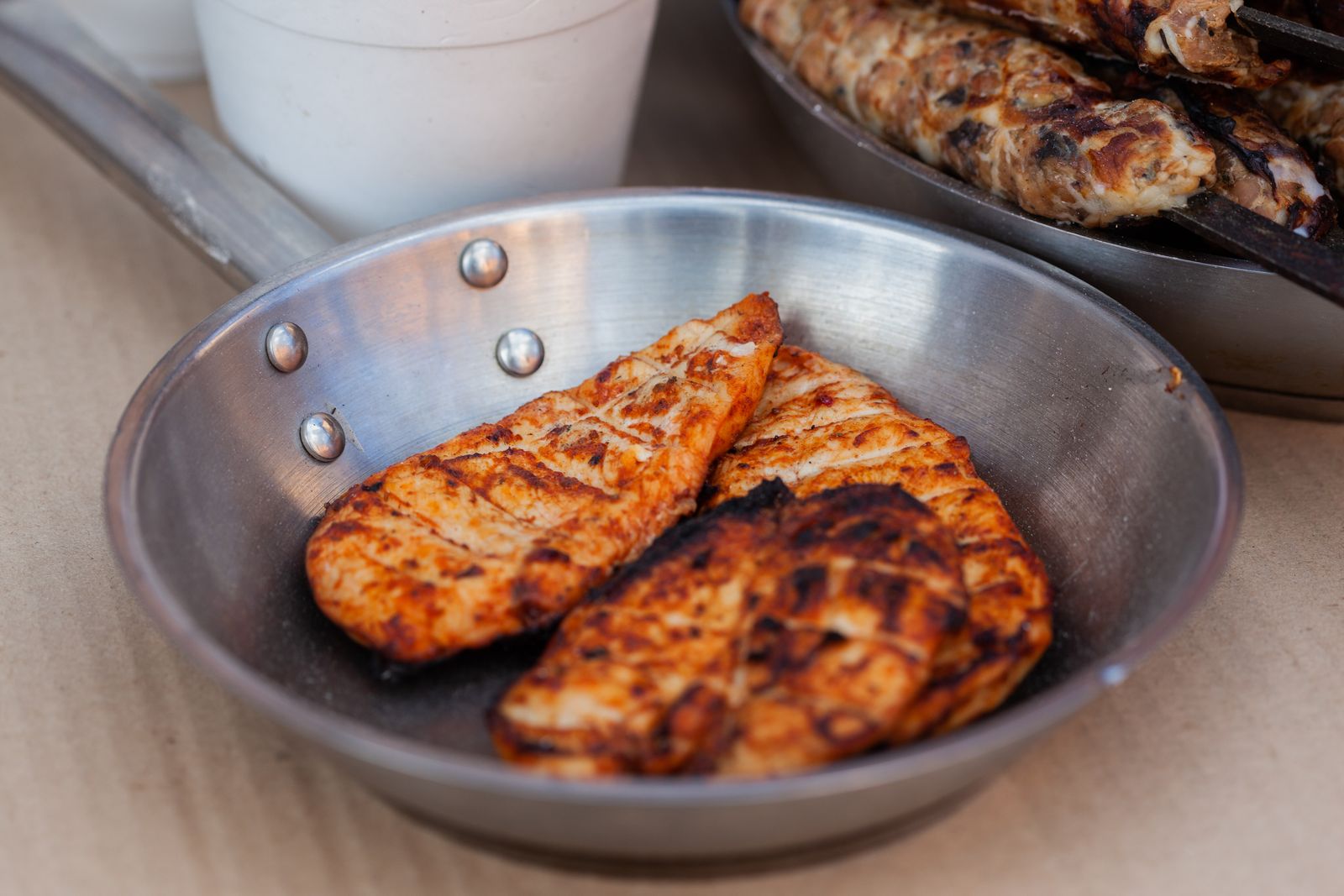 Golden seared chicken breasts in a skillet