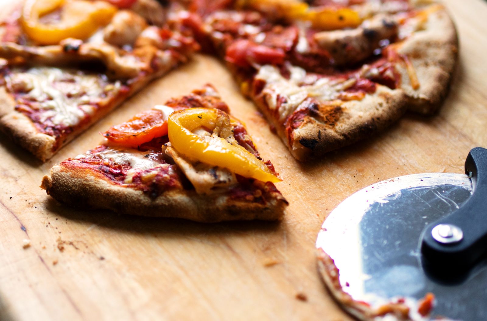 Air fryer hacks: leftover pizza slices on a wooden board