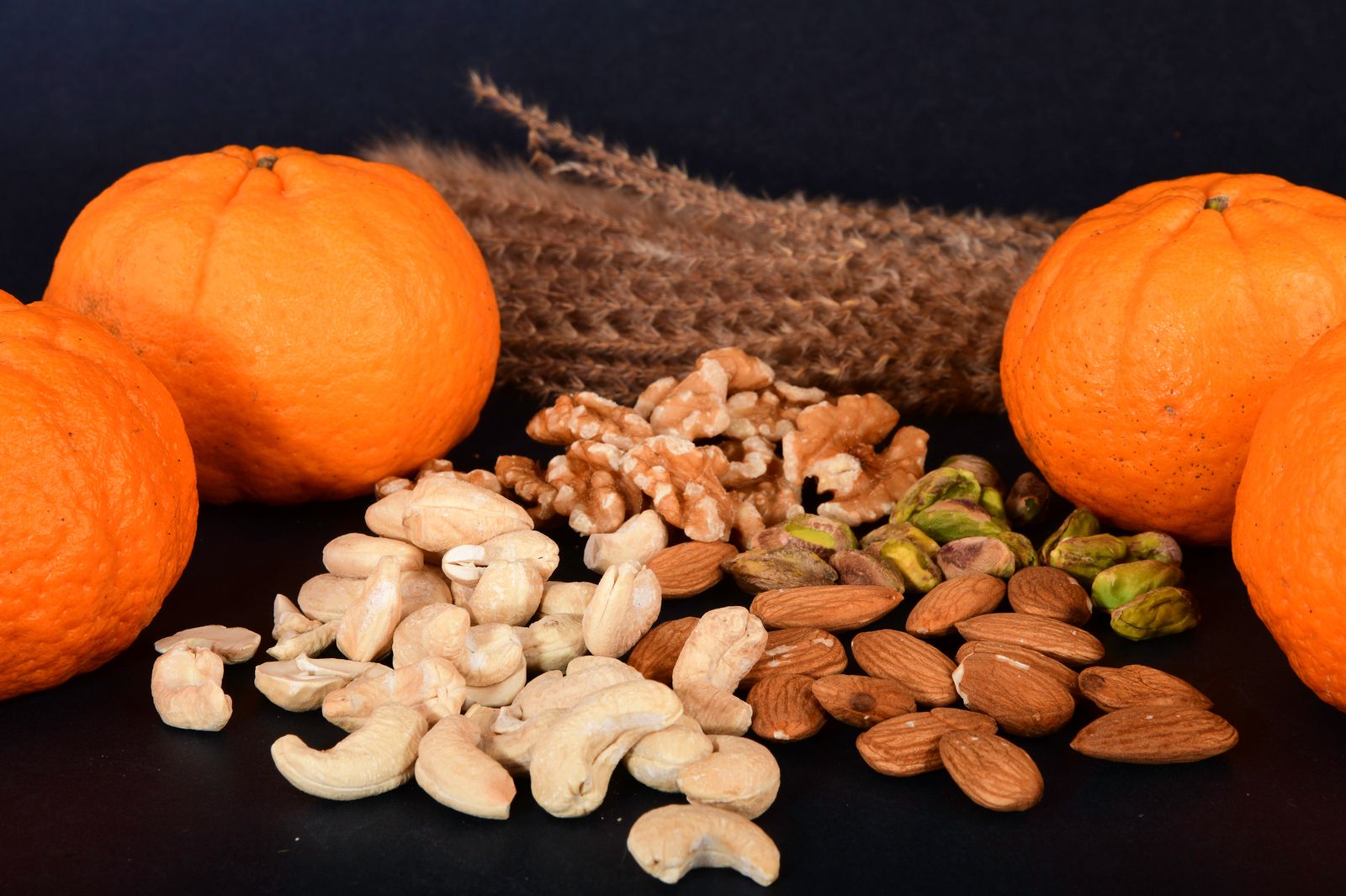 Cardiologist food rule swaps: mixed nuts and fresh oranges
