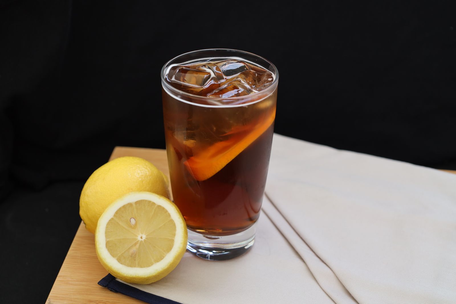Glass of unsweetened iced tea with lemon slices