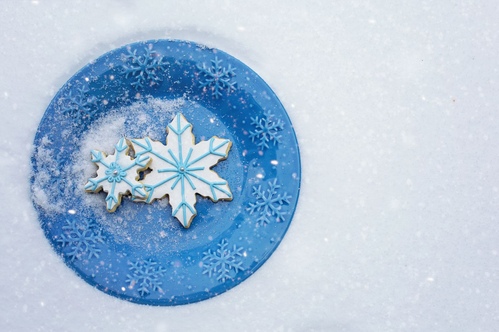 Snowflake cookie decorated with royal icing