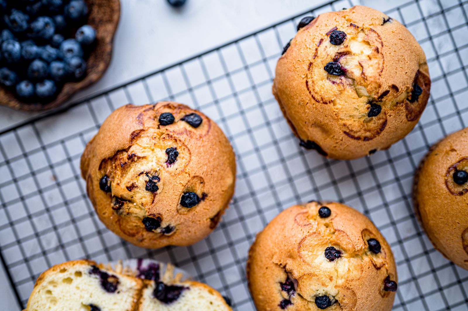 Blueberry muffins cooling on a wire rack