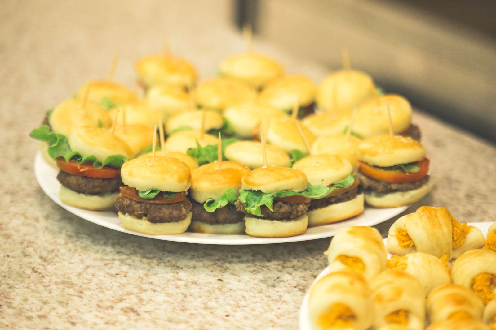 Platter of mini slider burgers for an all-day tournament