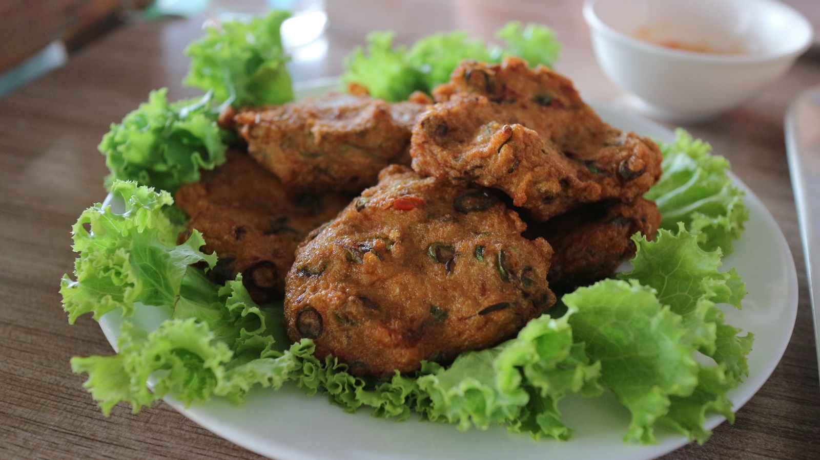Golden crispy patties on a bed of lettuce