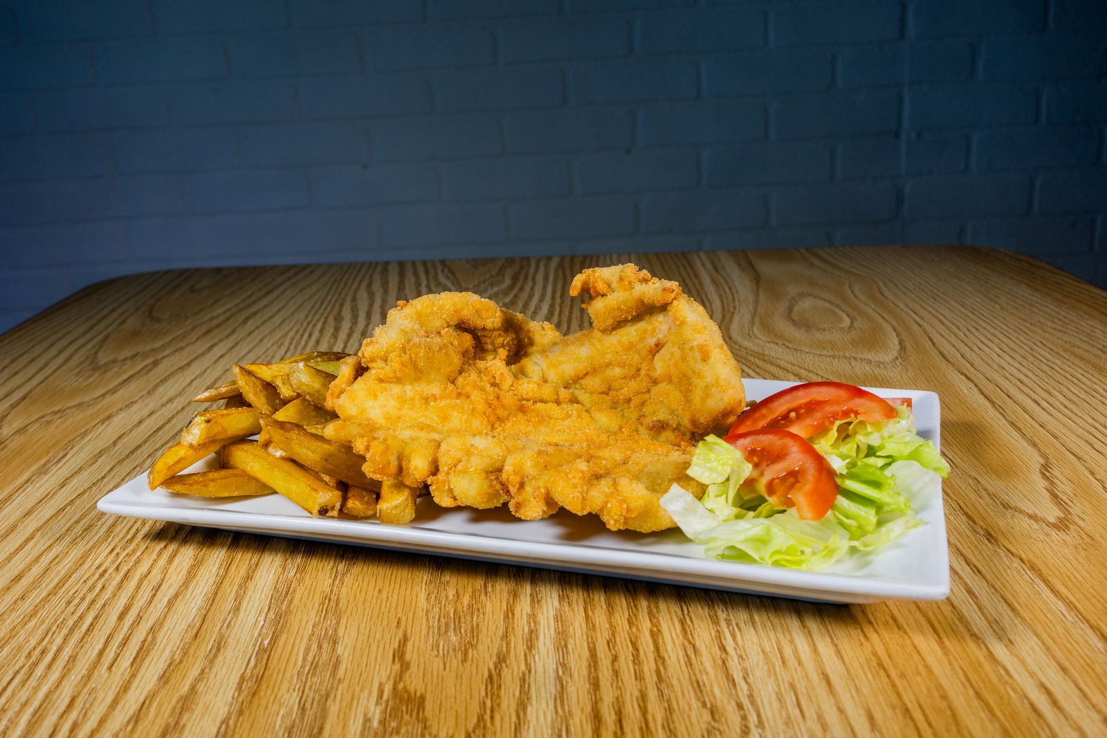 Cornmeal fried catfish on a plate