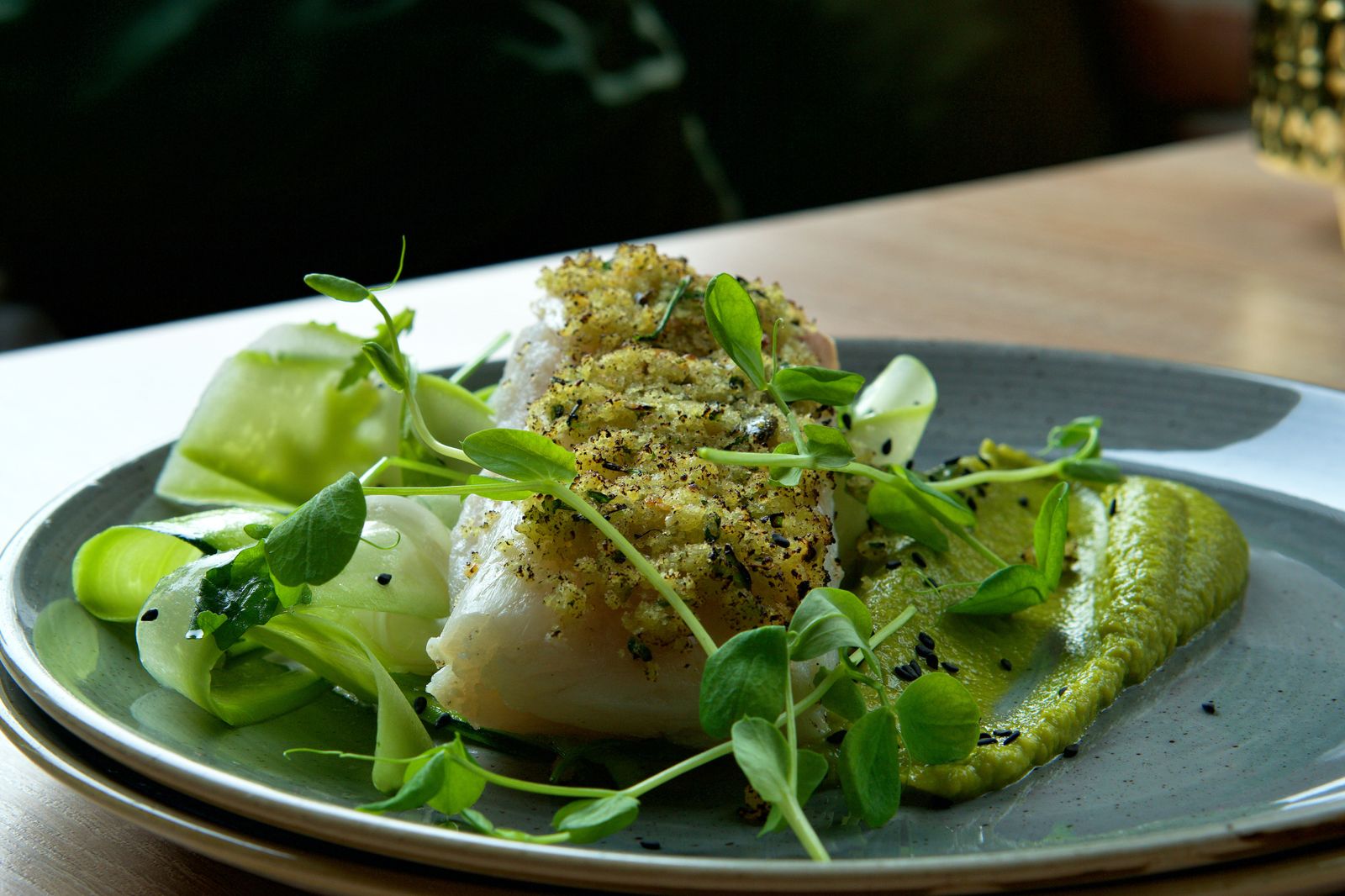 White fish recipes: baked cod fillet with lemon butter and greens