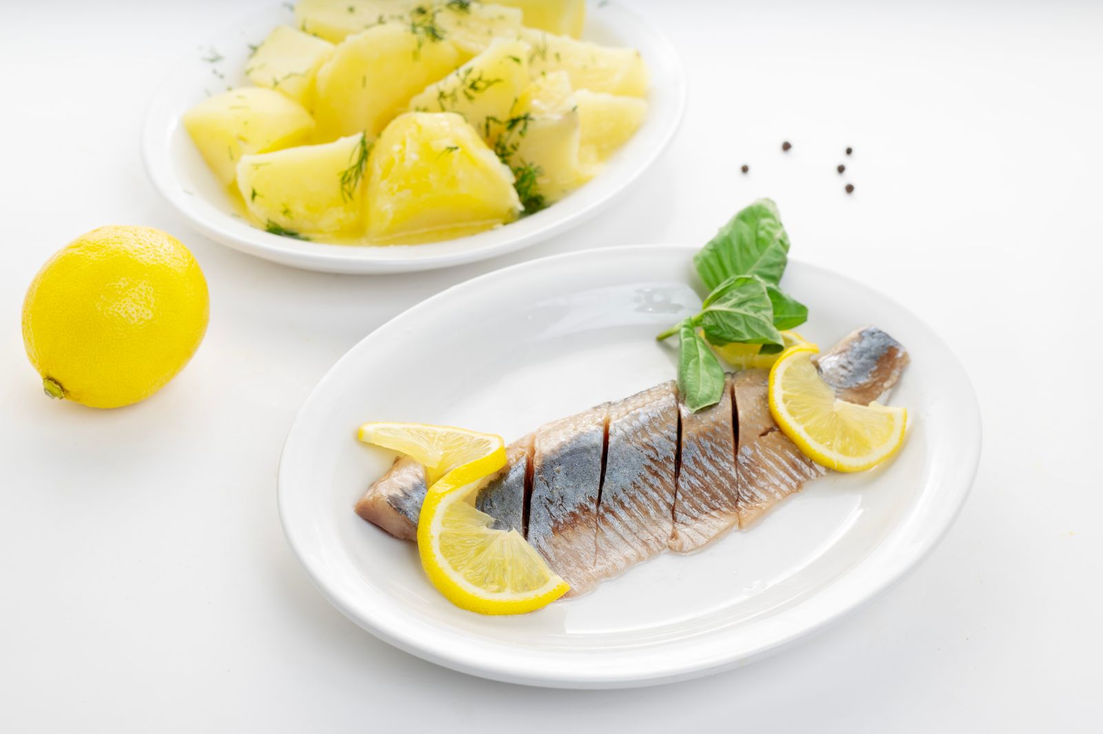 White fish recipes: baked fish fillet with potatoes and lemon