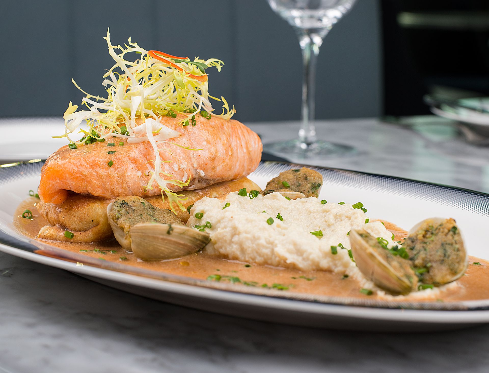 Creamy salmon with mushrooms in a rich cream sauce on a platter
