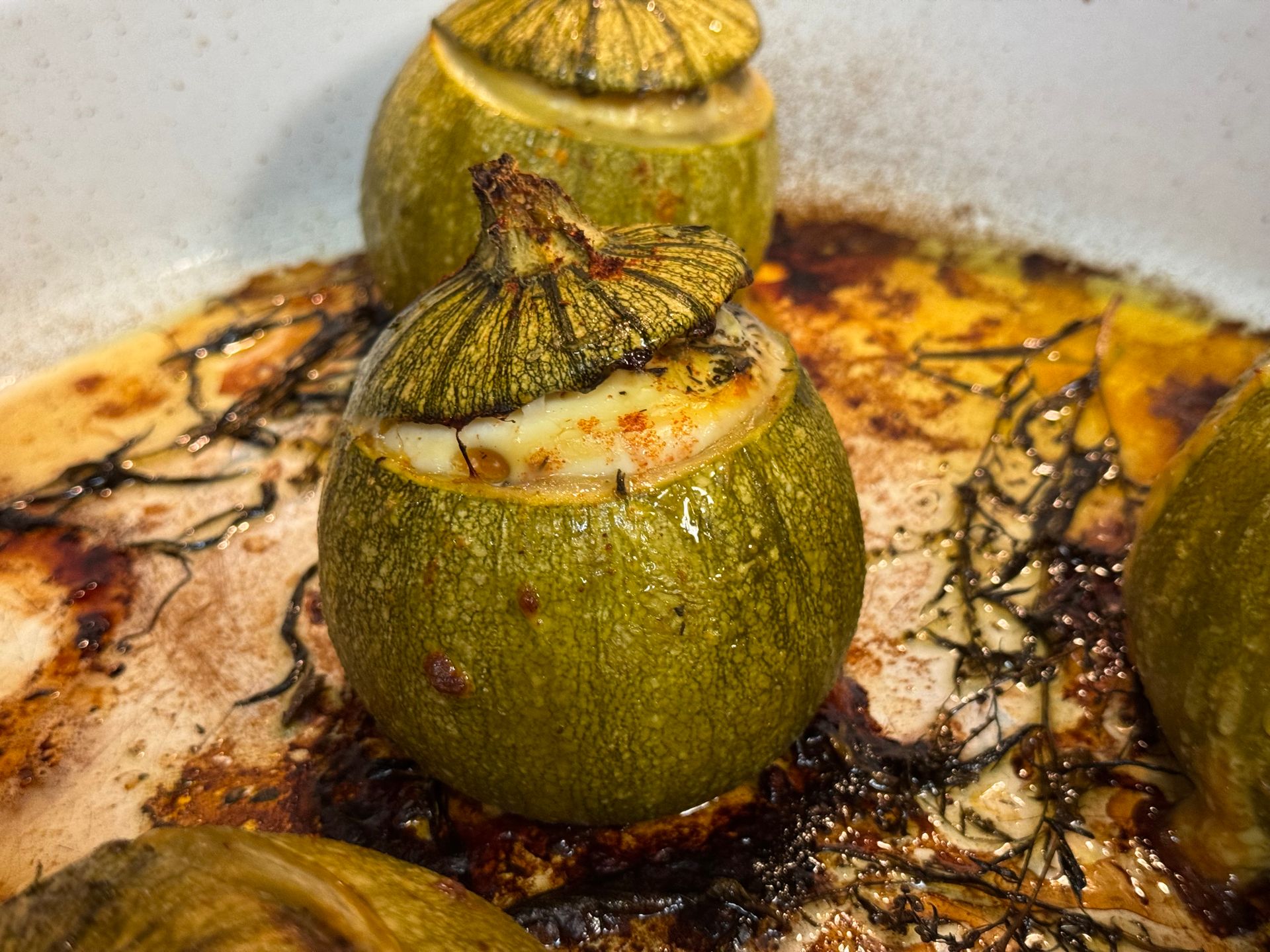Round zucchini stuffed and roasted until golden