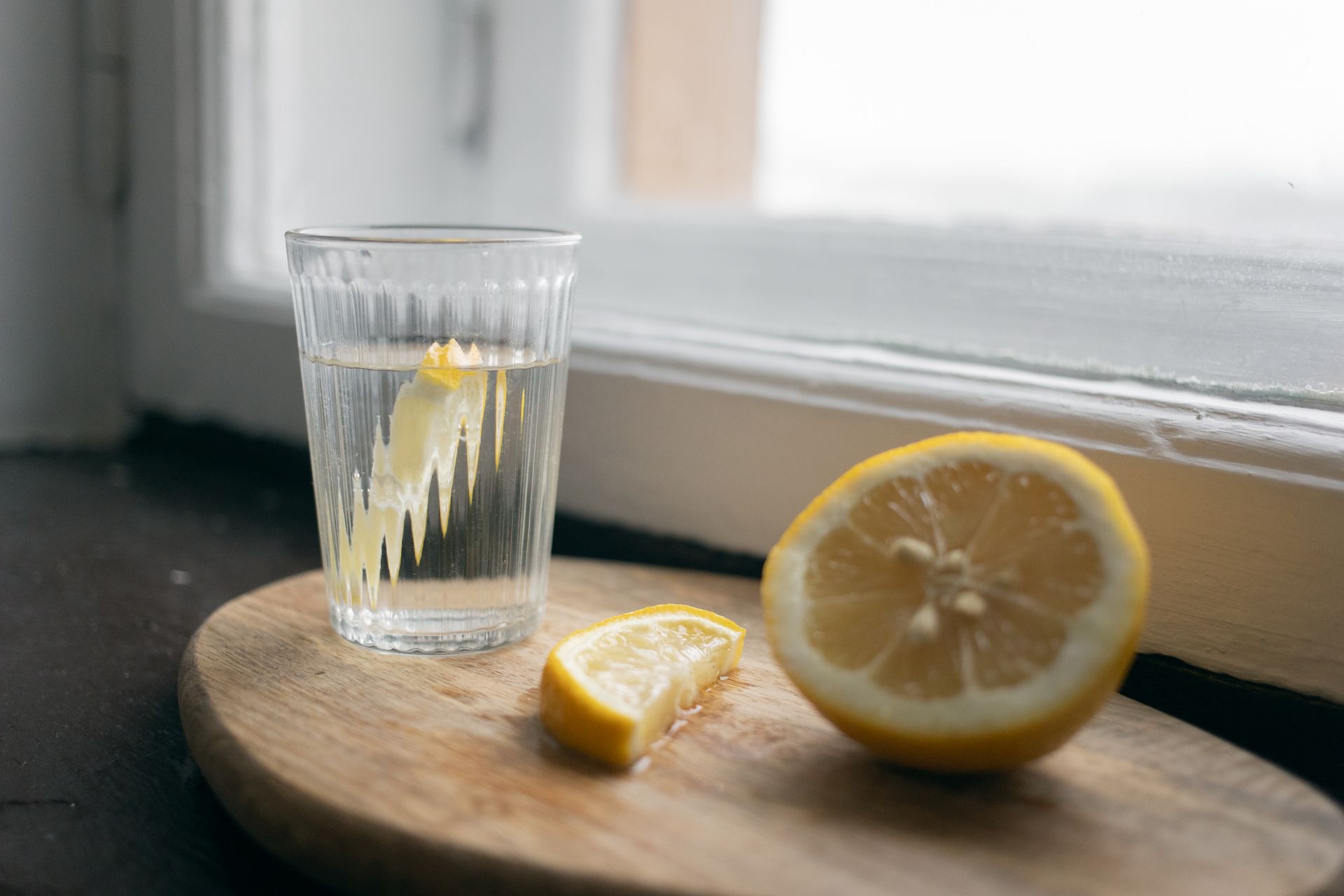 Fresh lemon slices on a wooden board