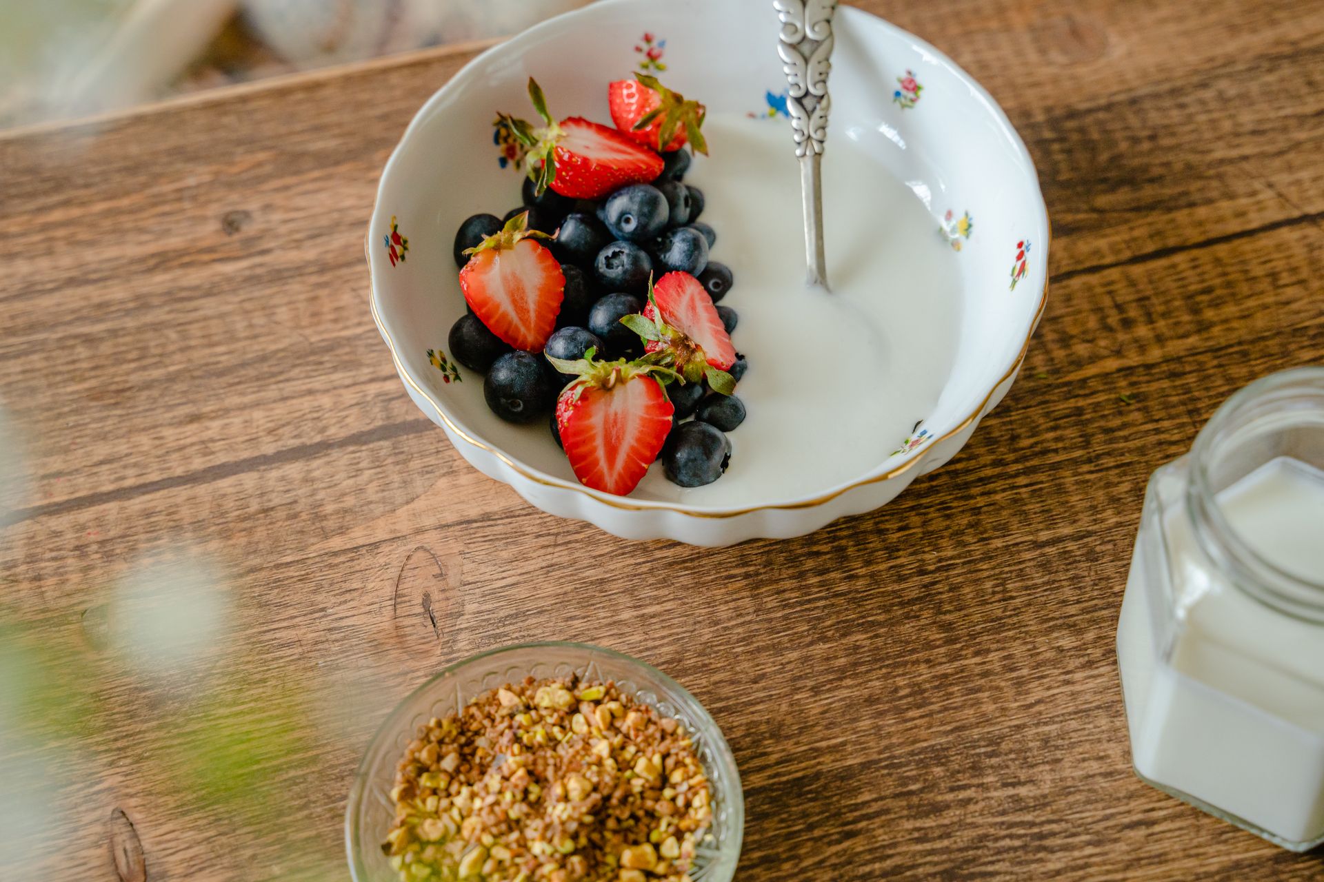 Bowl of creamy yogurt with fresh berries and granola