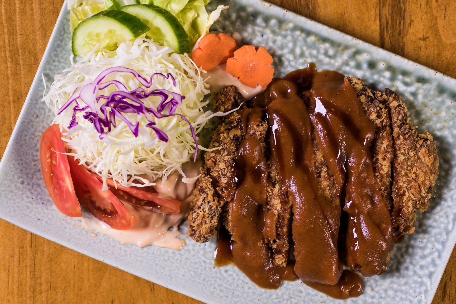 Classic pork tonkatsu with shredded cabbage and sauce, the dish that gave egg katsu its name