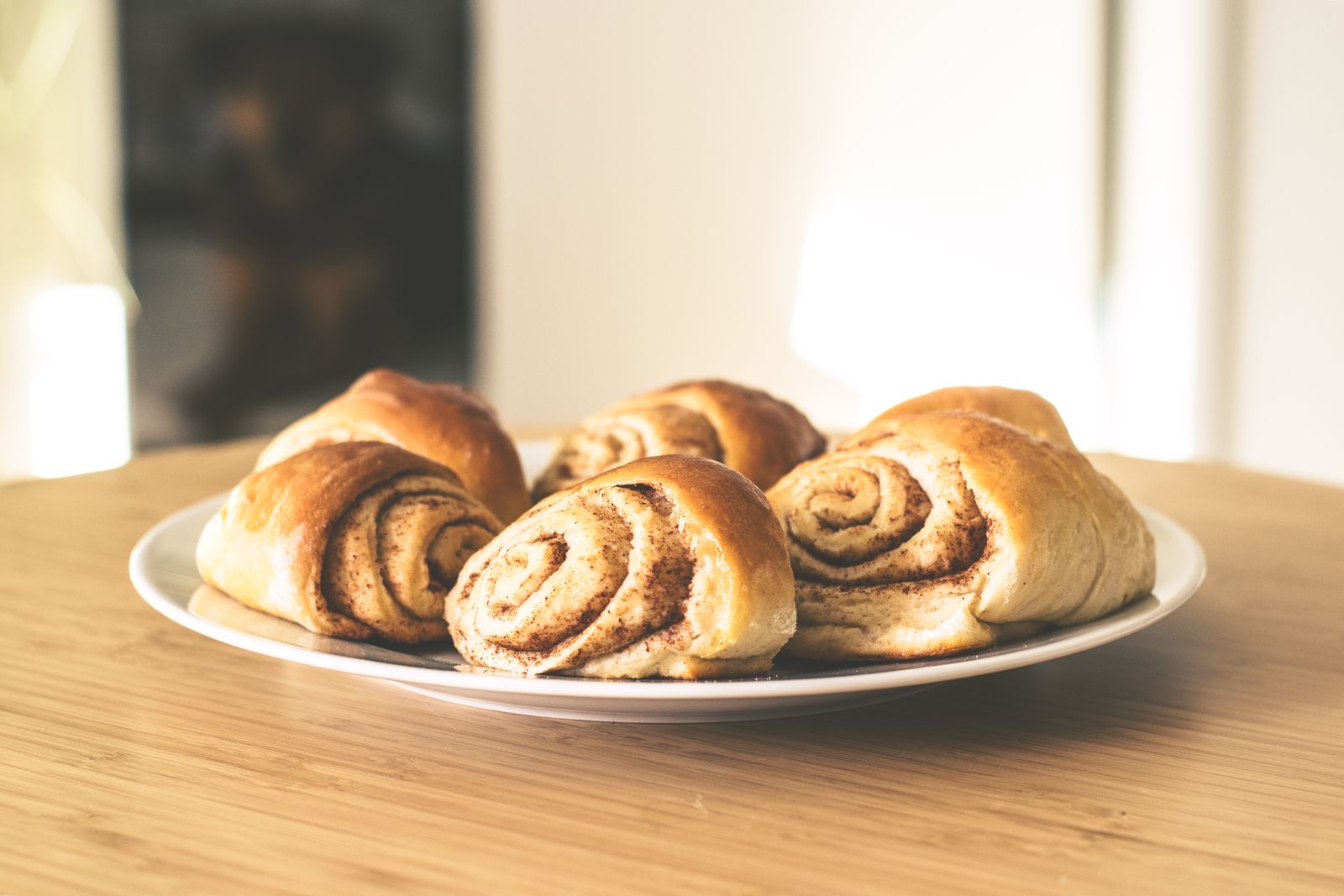 Warm cinnamon rolls on a white plate
