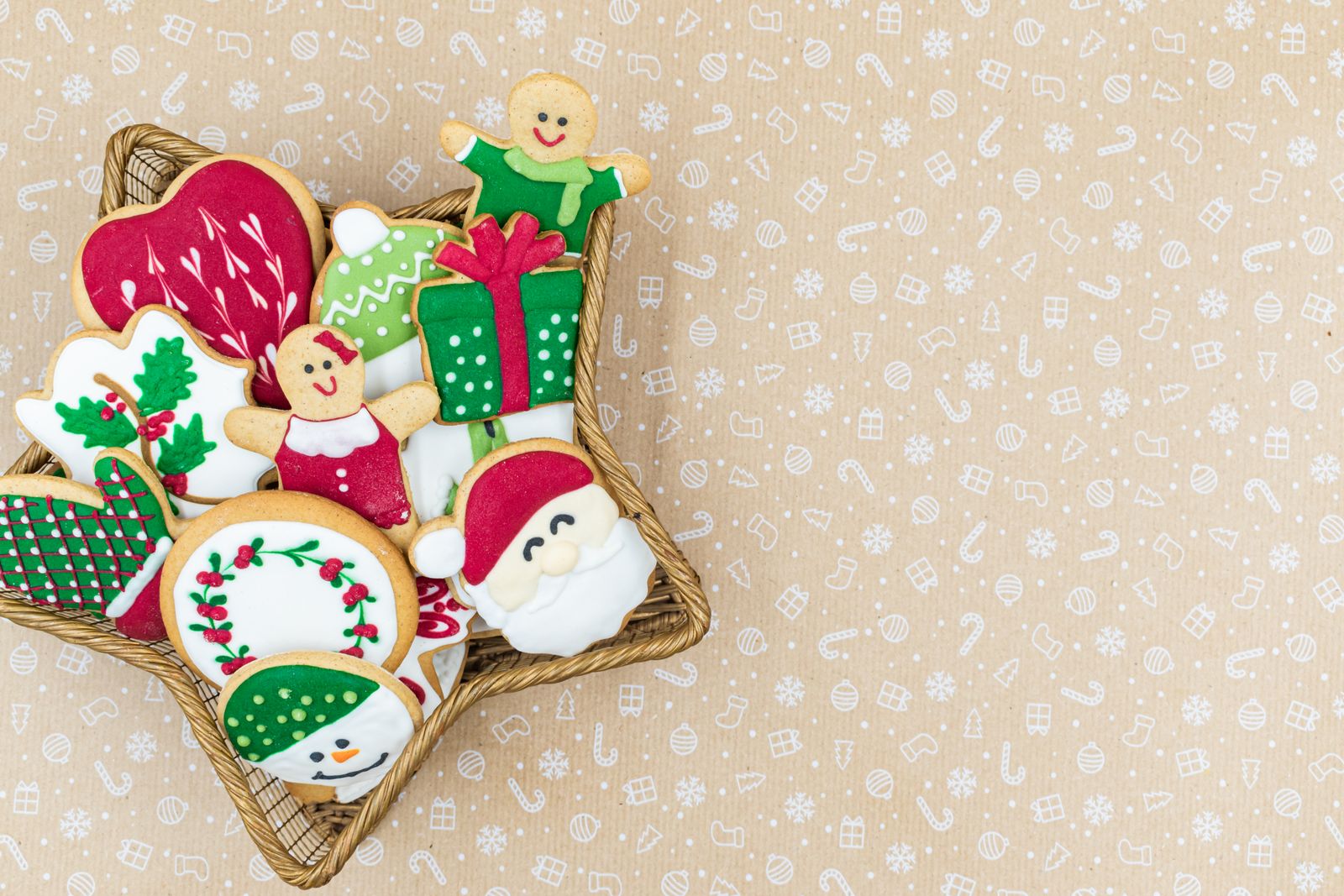 Decorated Christmas sugar cookies in a star shaped basket