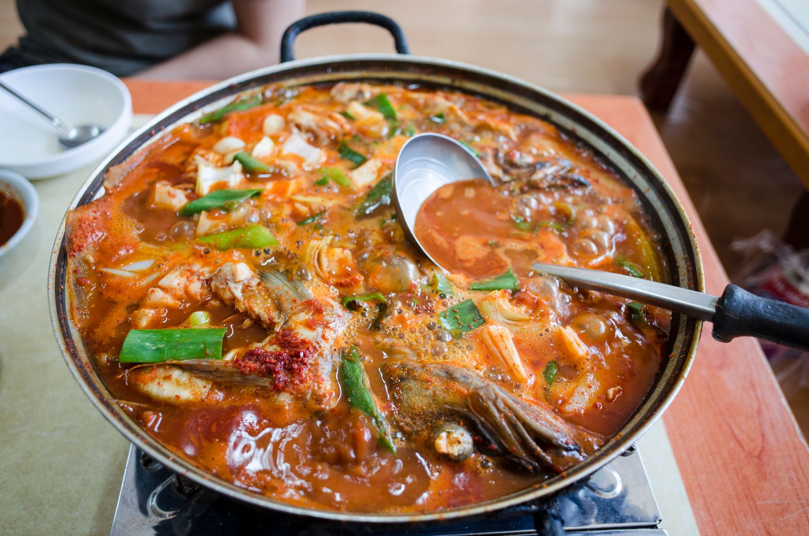 Seafood stew simmering with tomatoes and vegetables