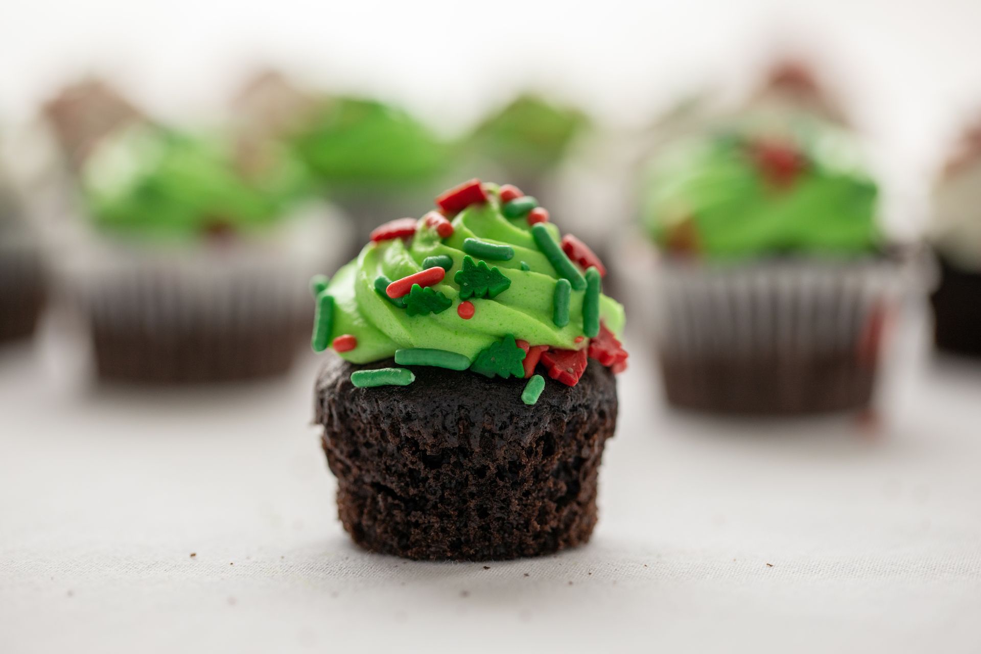Chocolate cupcakes with green buttercream and sprinkles for a pull-apart cupcake tree