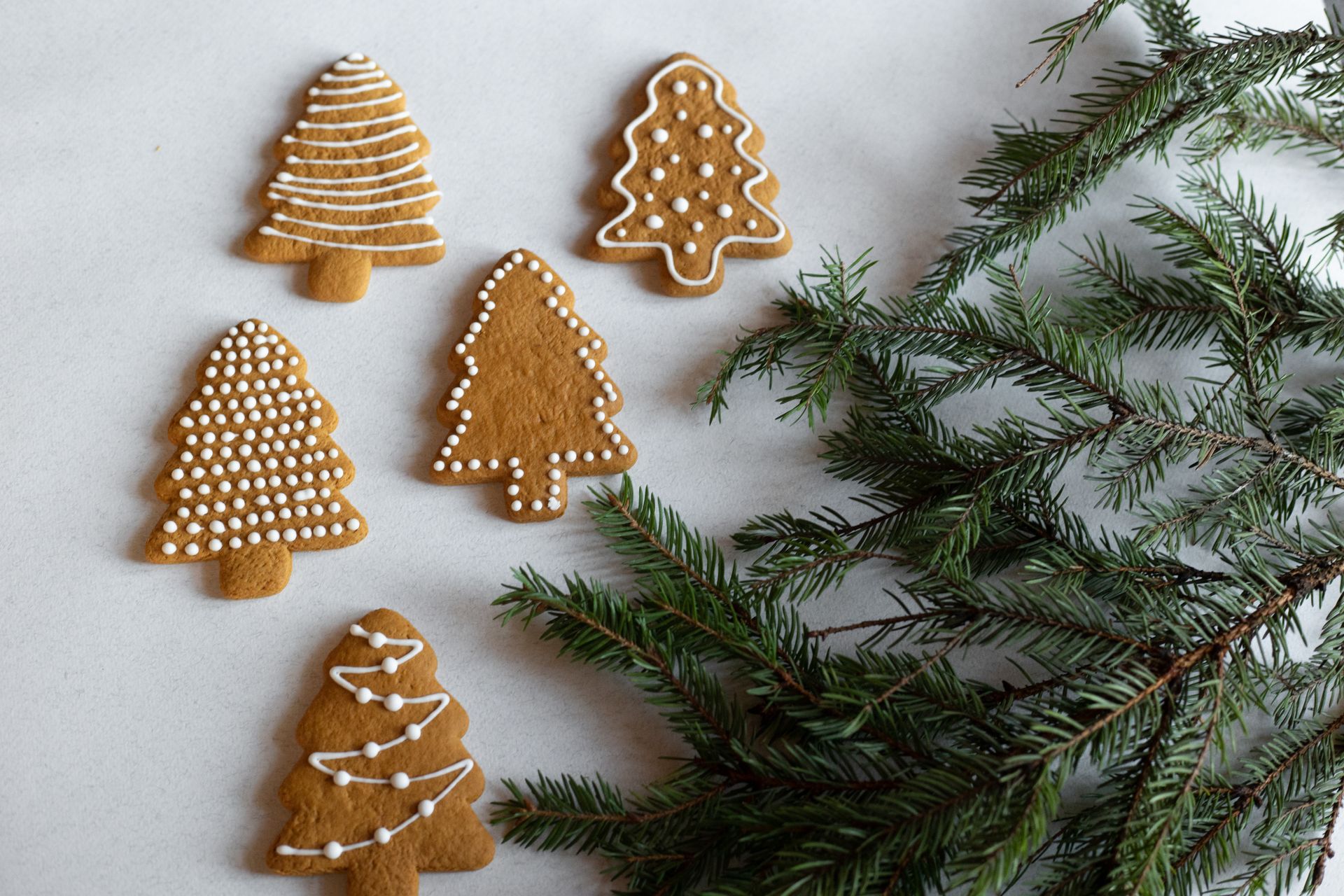 Gingerbread Christmas tree cookies with white icing