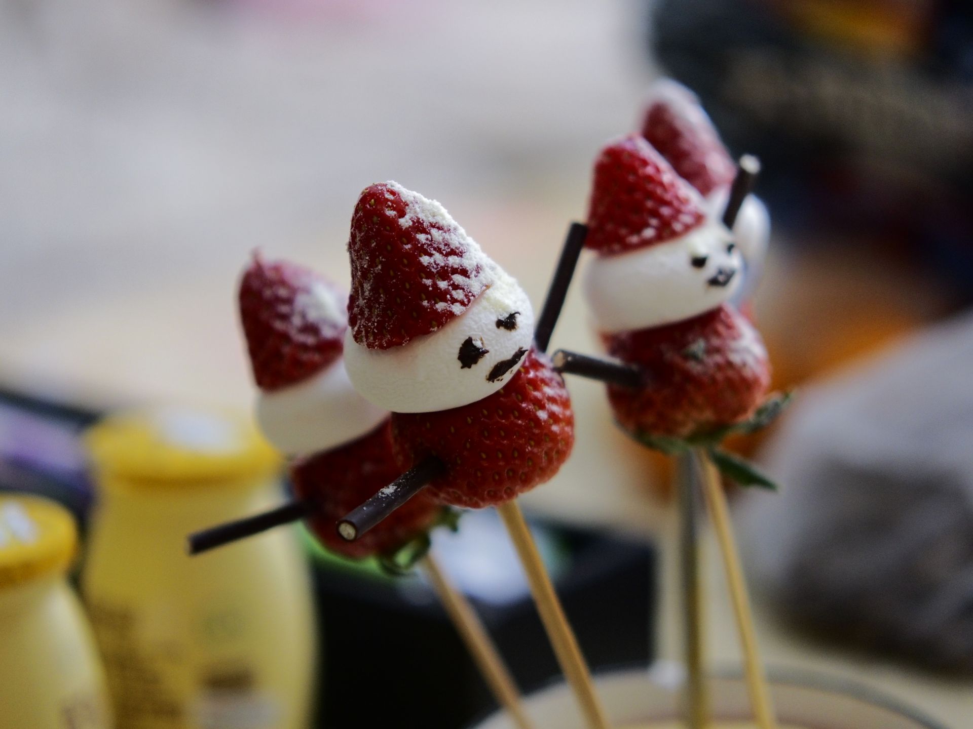Strawberry Santas on sticks for a Christmas dessert table