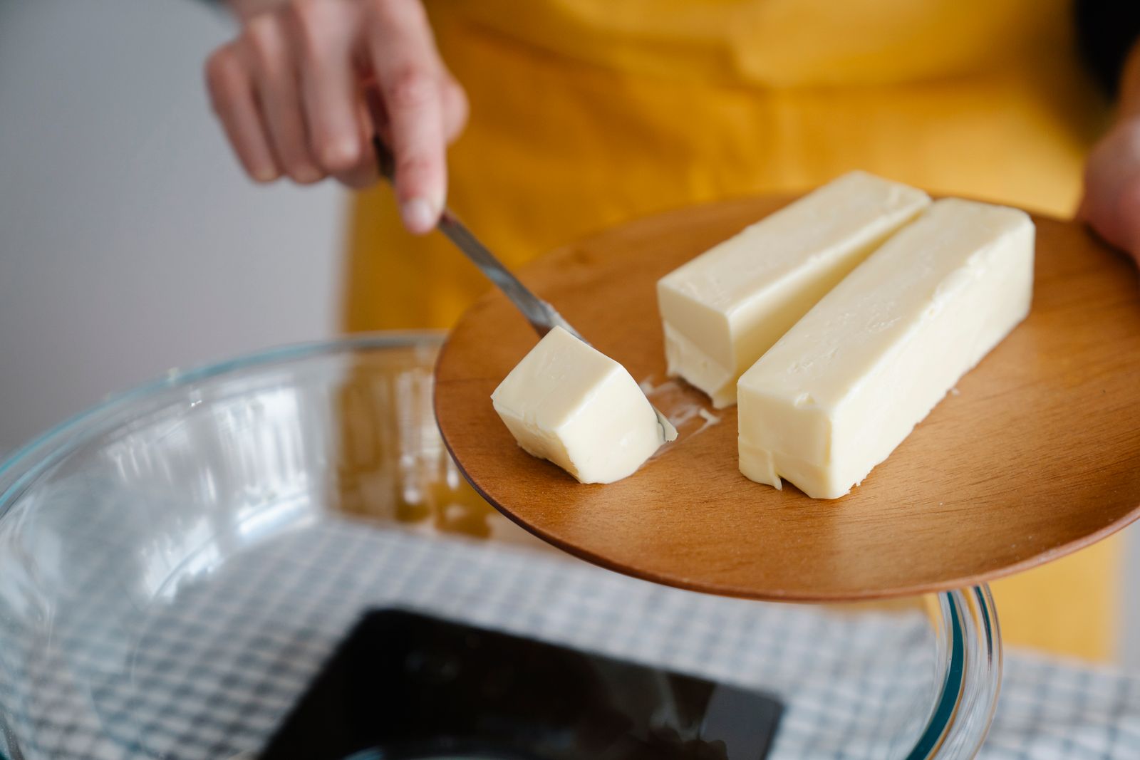 Block of homemade butter being sliced