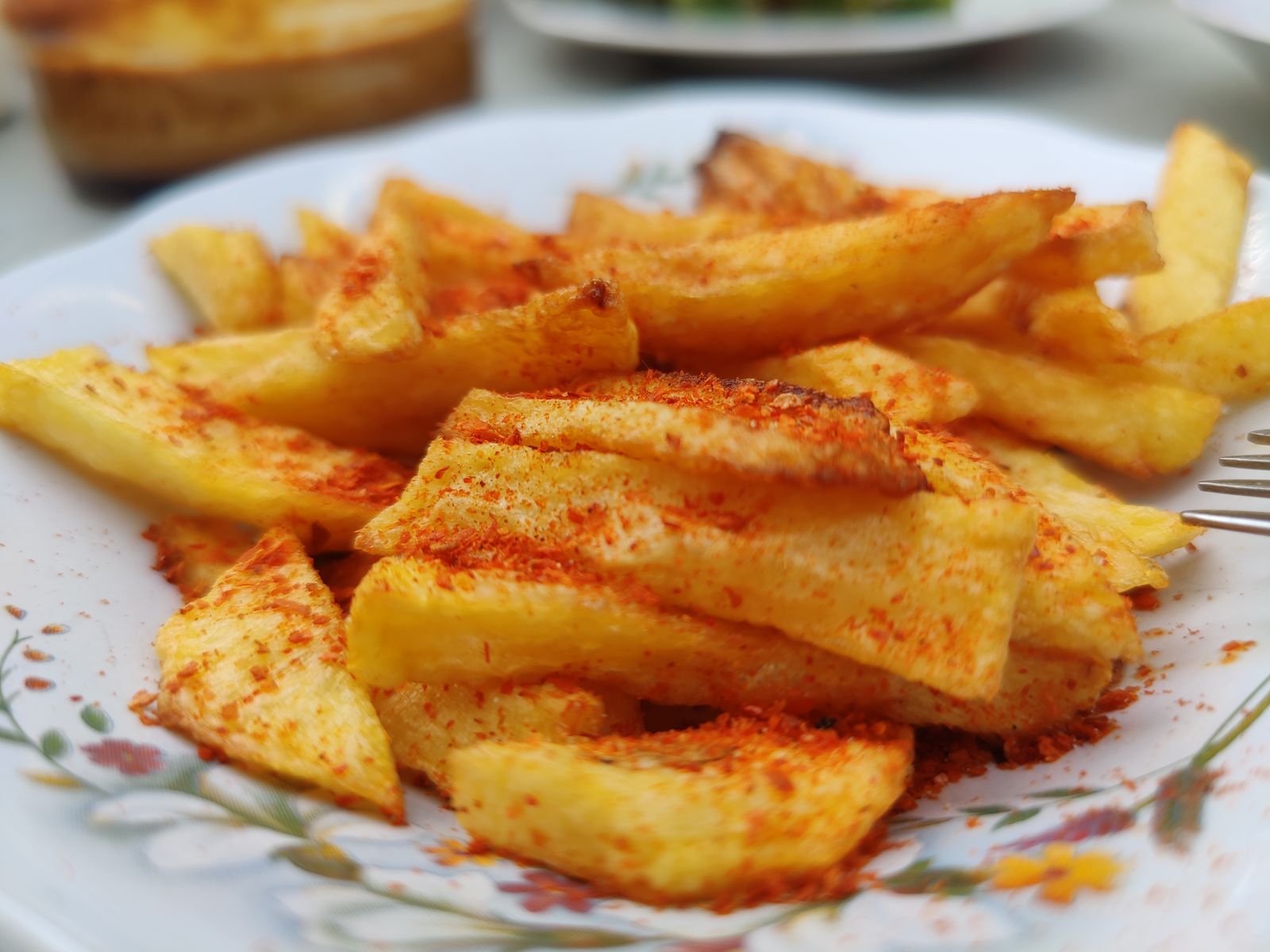 Thick potato sticks dusted with red spice seasoning