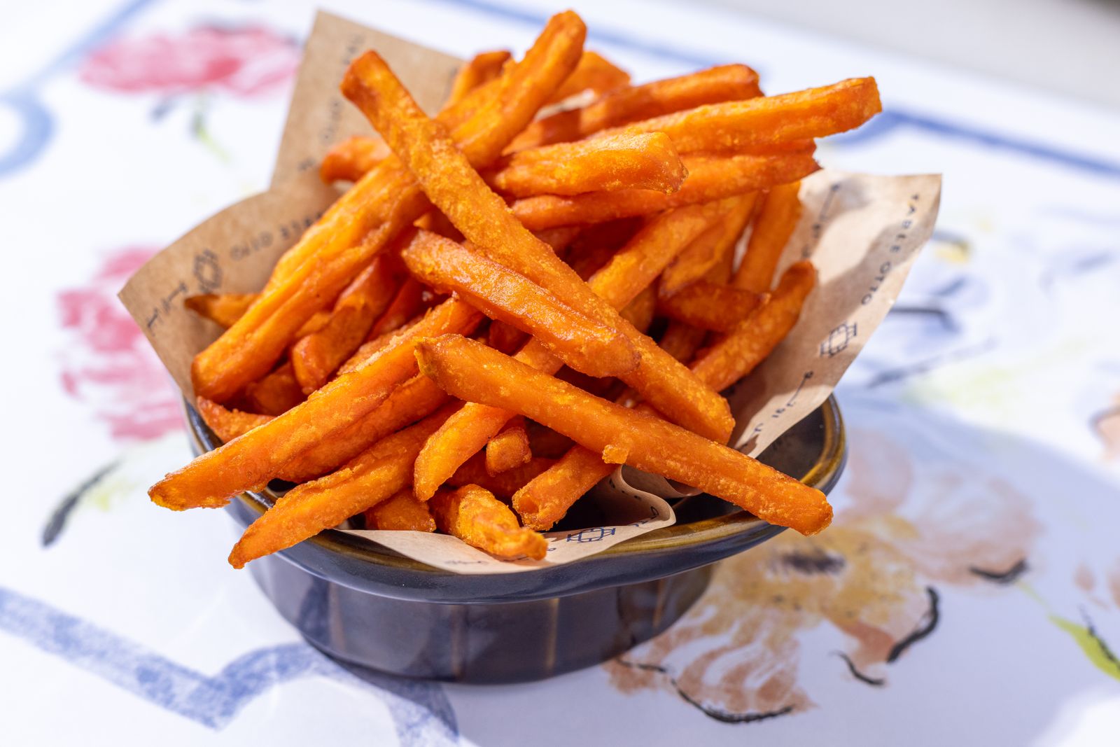 Sweet potato fries in a basket on a table, homemade fries
