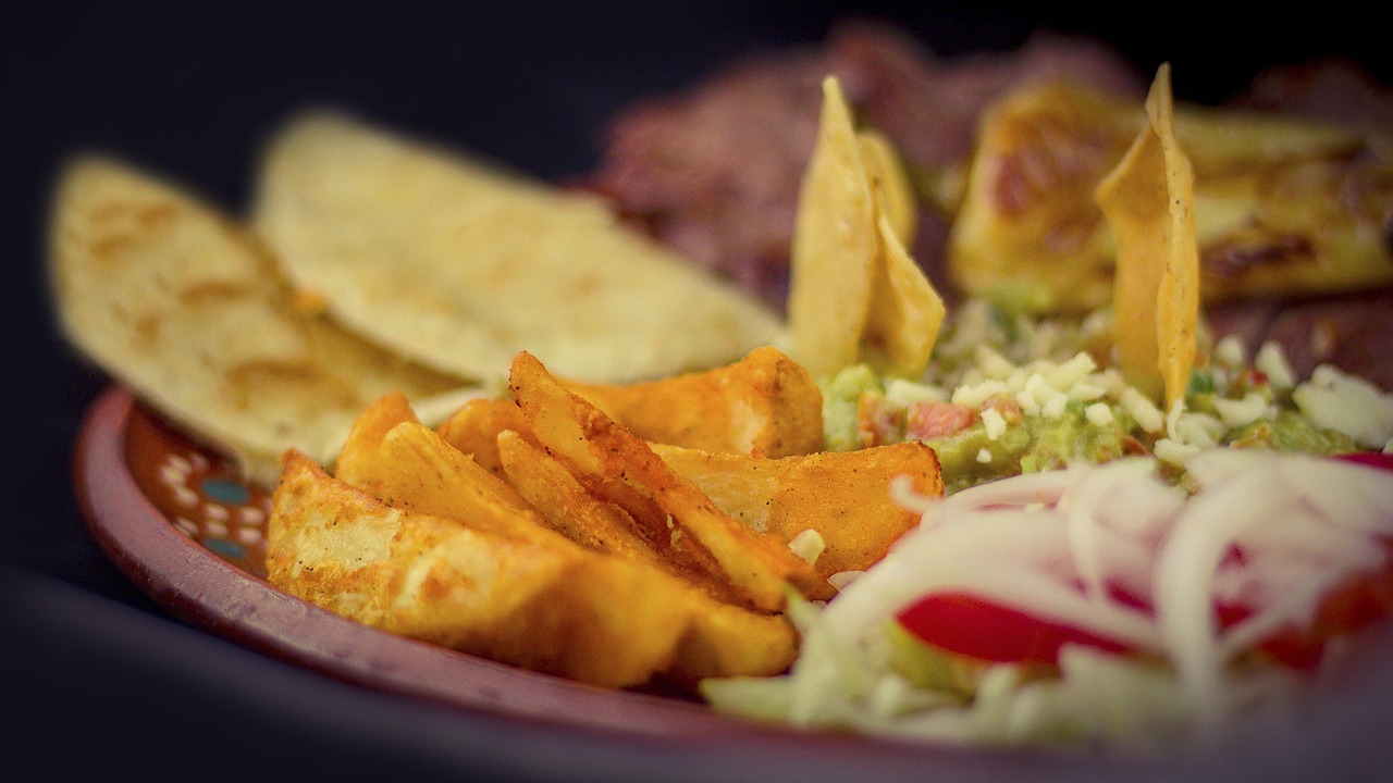 Golden cheese quesadillas cut into wedges with salsa