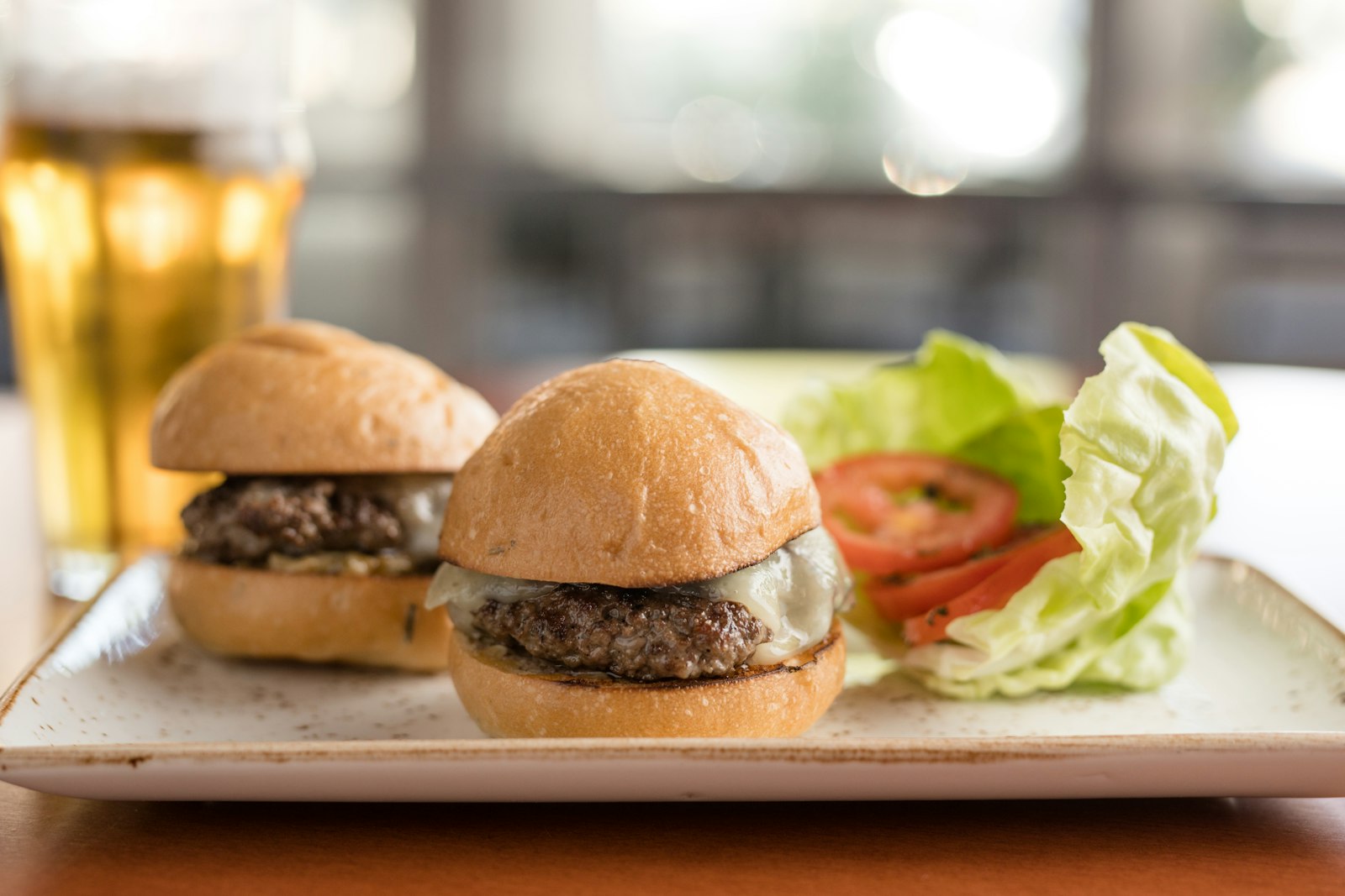 Platter of mini cheeseburger sliders for Halloween appetizers