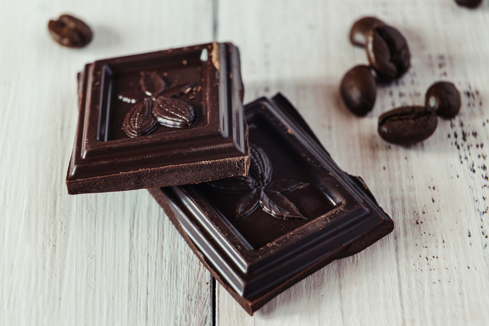 Pieces of dark chocolate on a table, a Bryan Johnson sweet bite