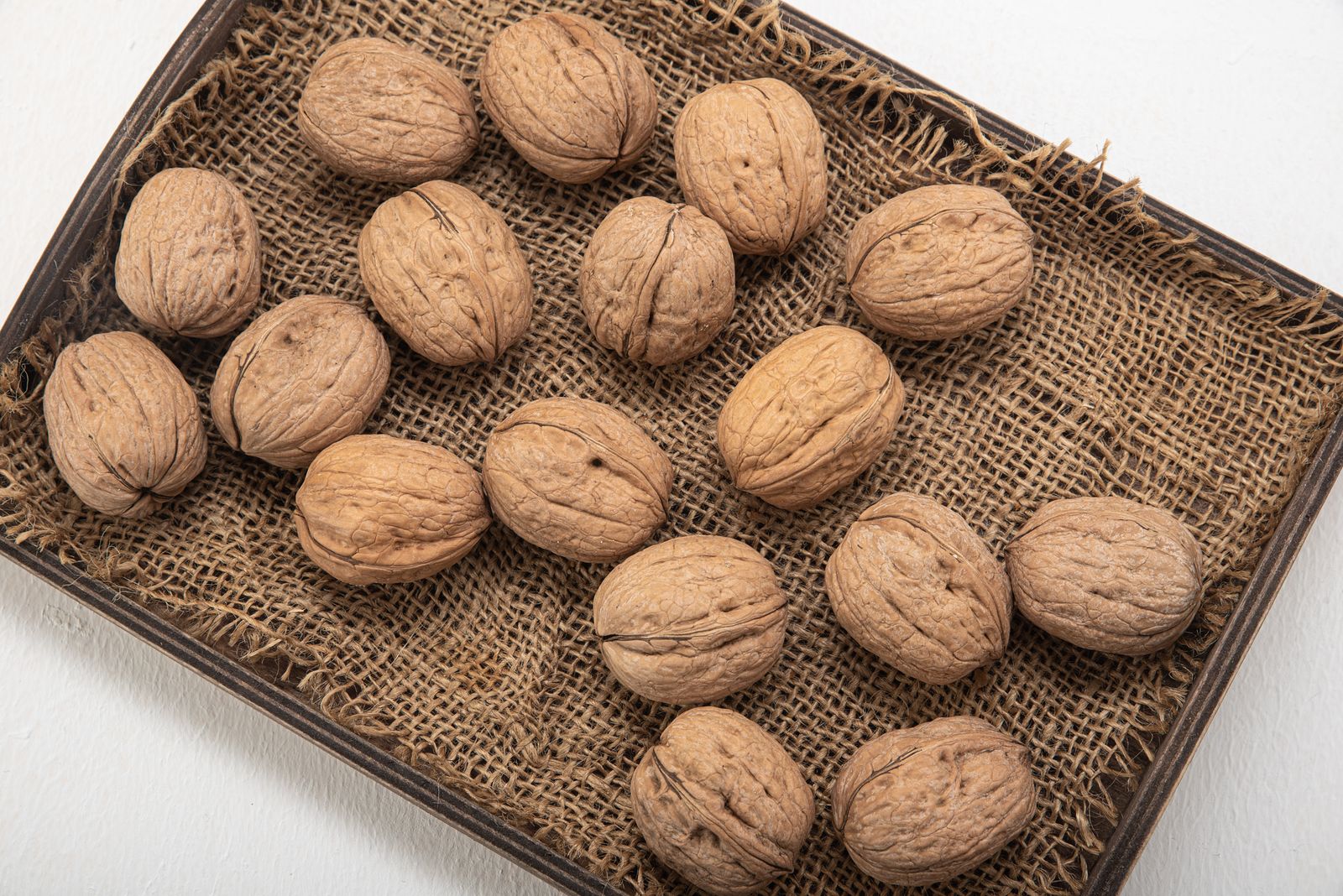 Walnuts served on a woven tray