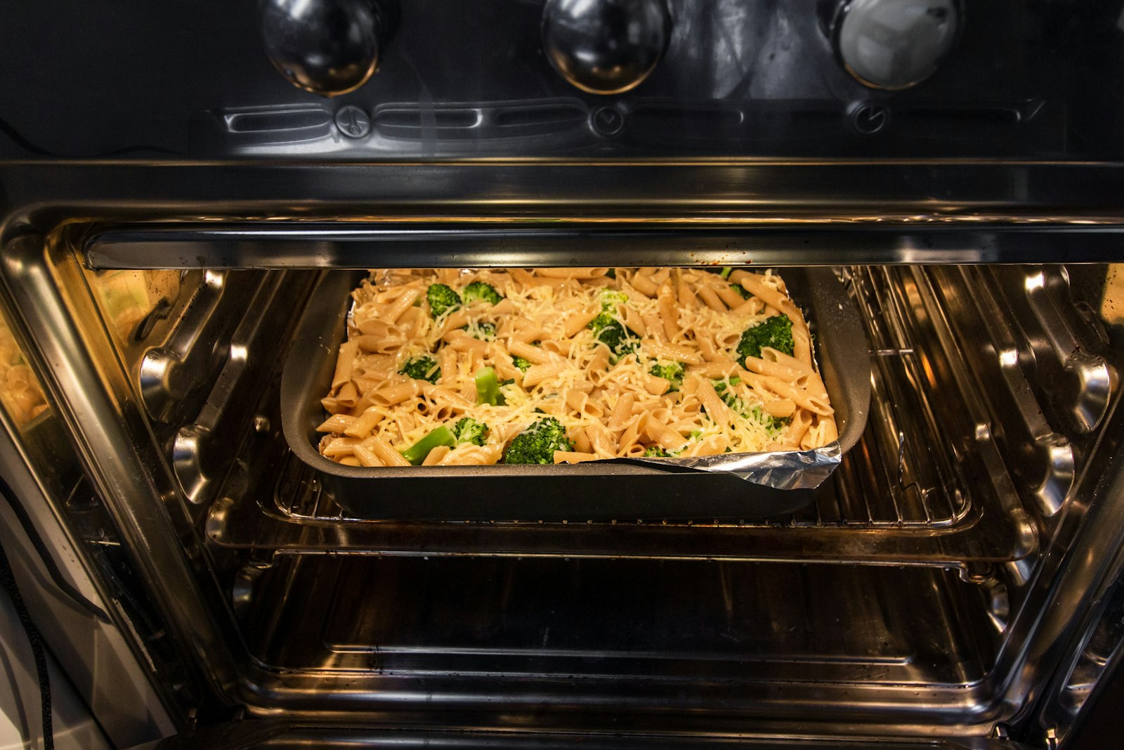 Big pan of creamy pasta with golden cheddar for the holiday table